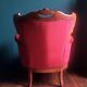 Baroque style carved wooden armchair in burgundy red velvet
