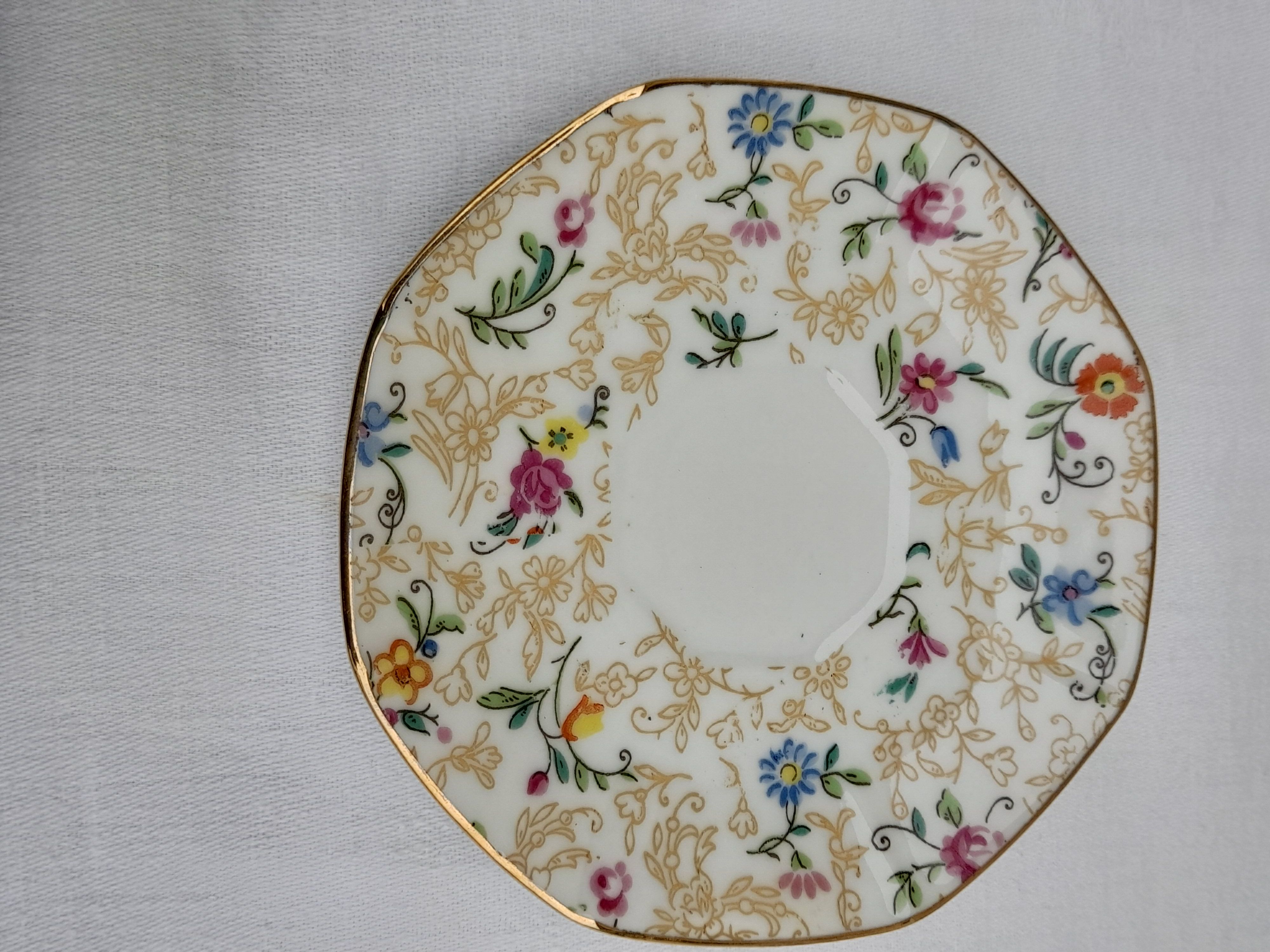 Lourioux Foecy porcelain tea set 12 cups, a sugar bowl and a crèmier