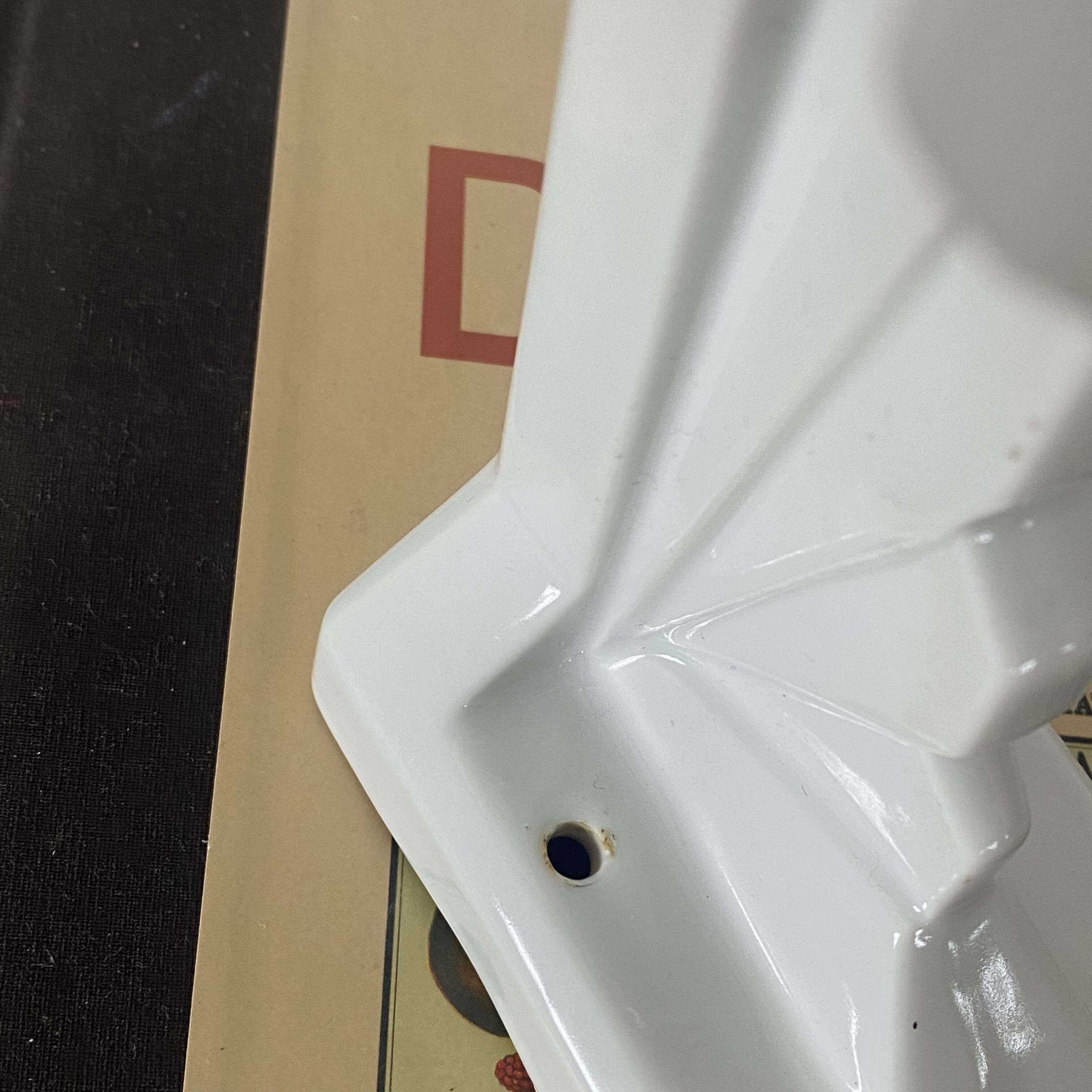 Pair of Art Deco wall sconces in ceramic with opaline glass shades.