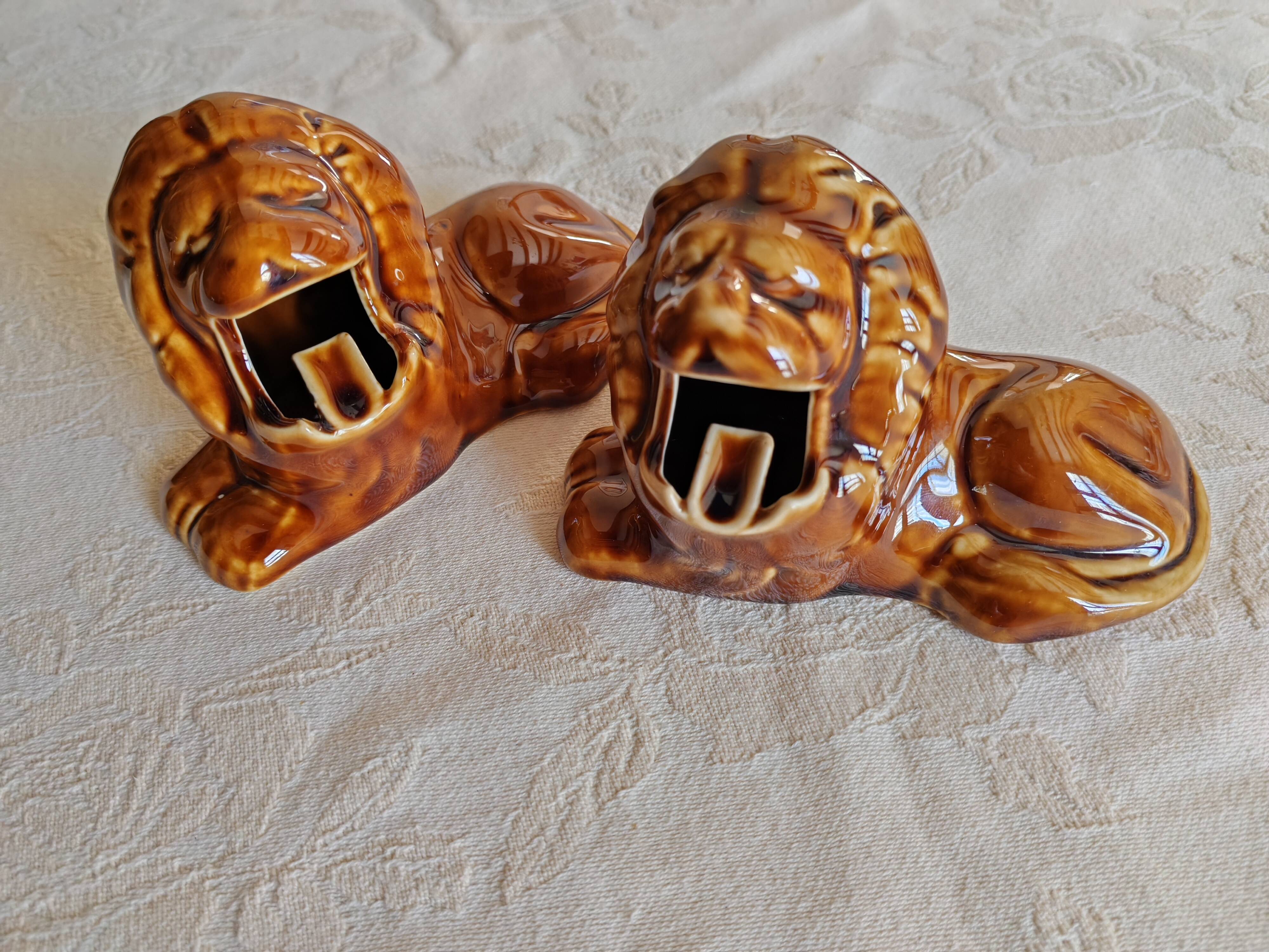 Pair of vintage lion ashtrays