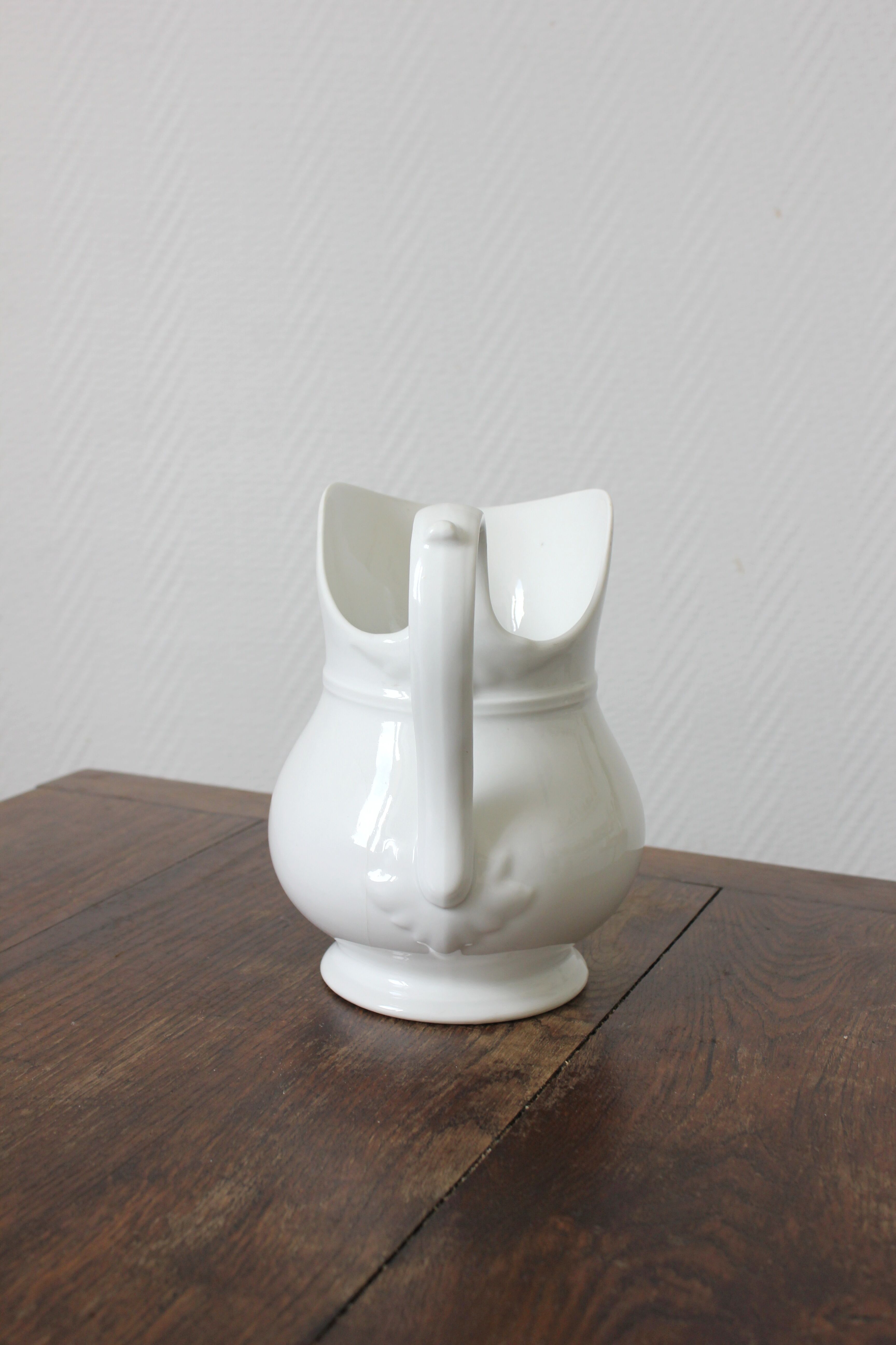 Antique white porcelain jug from the 19th century