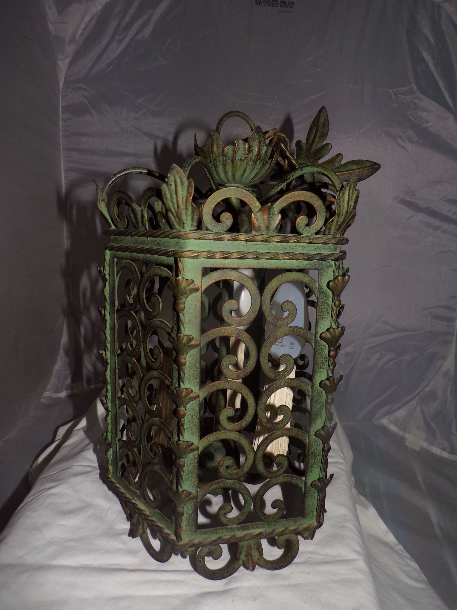 Lantern Cage 3 green lacquered metal lights work neatly from the 70s