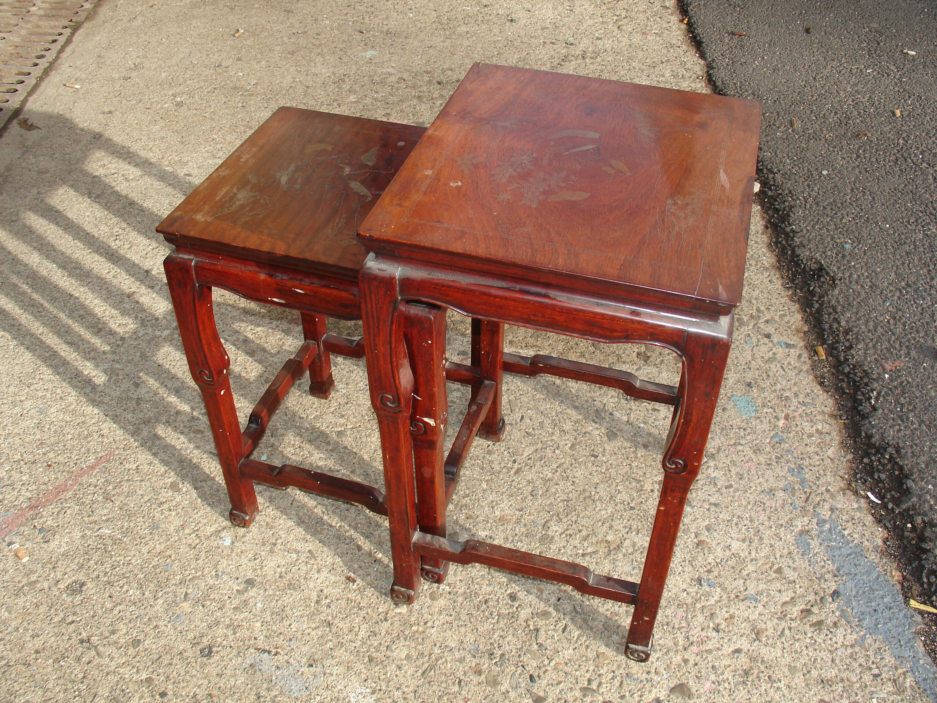 Nesting tables in ironwood with engraved decoration and gold highlights