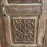 India. Bonnetière with a teak door finely carved by hand.