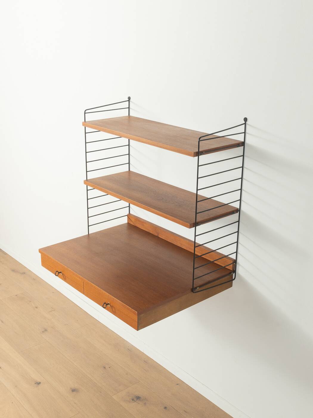 Original String shelf by Nils Strinning in teak veneer, 1949