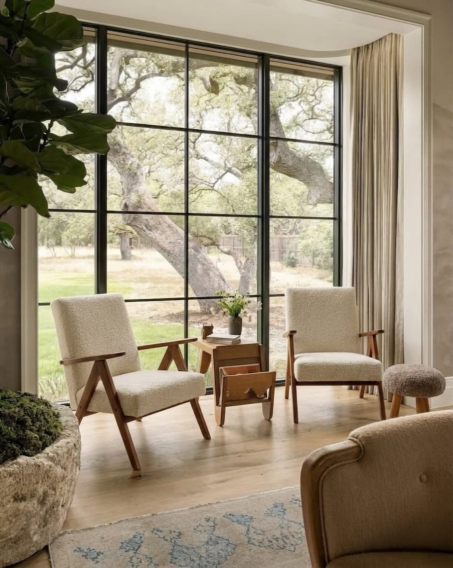 Pair of Mid-Century Modern armchairs in solid beech and boucle fabric.