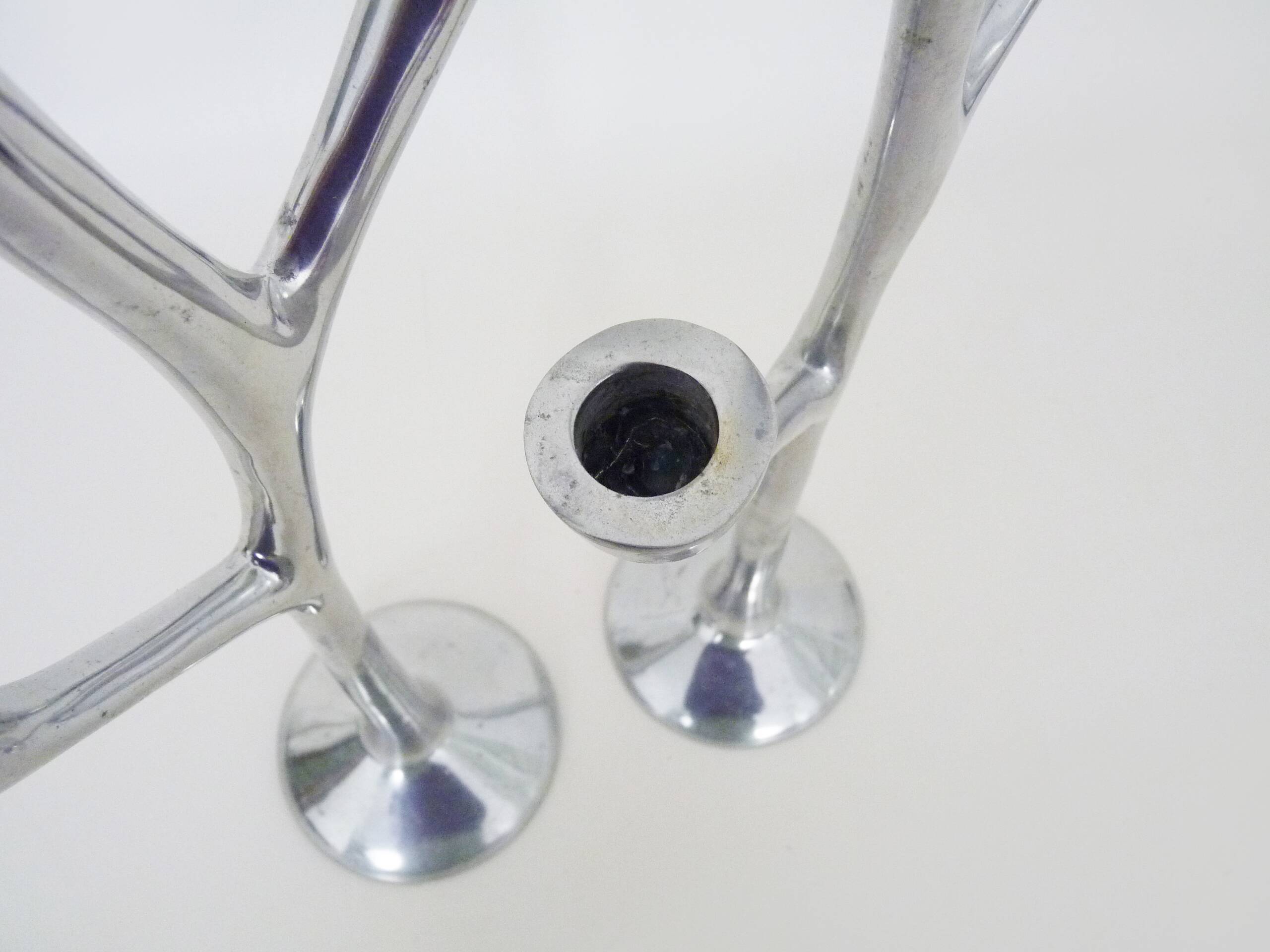 Pair of Italian "Tree" candlesticks in cast aluminum from the 80s