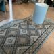Handmade turquoise and beige wool rug, new.