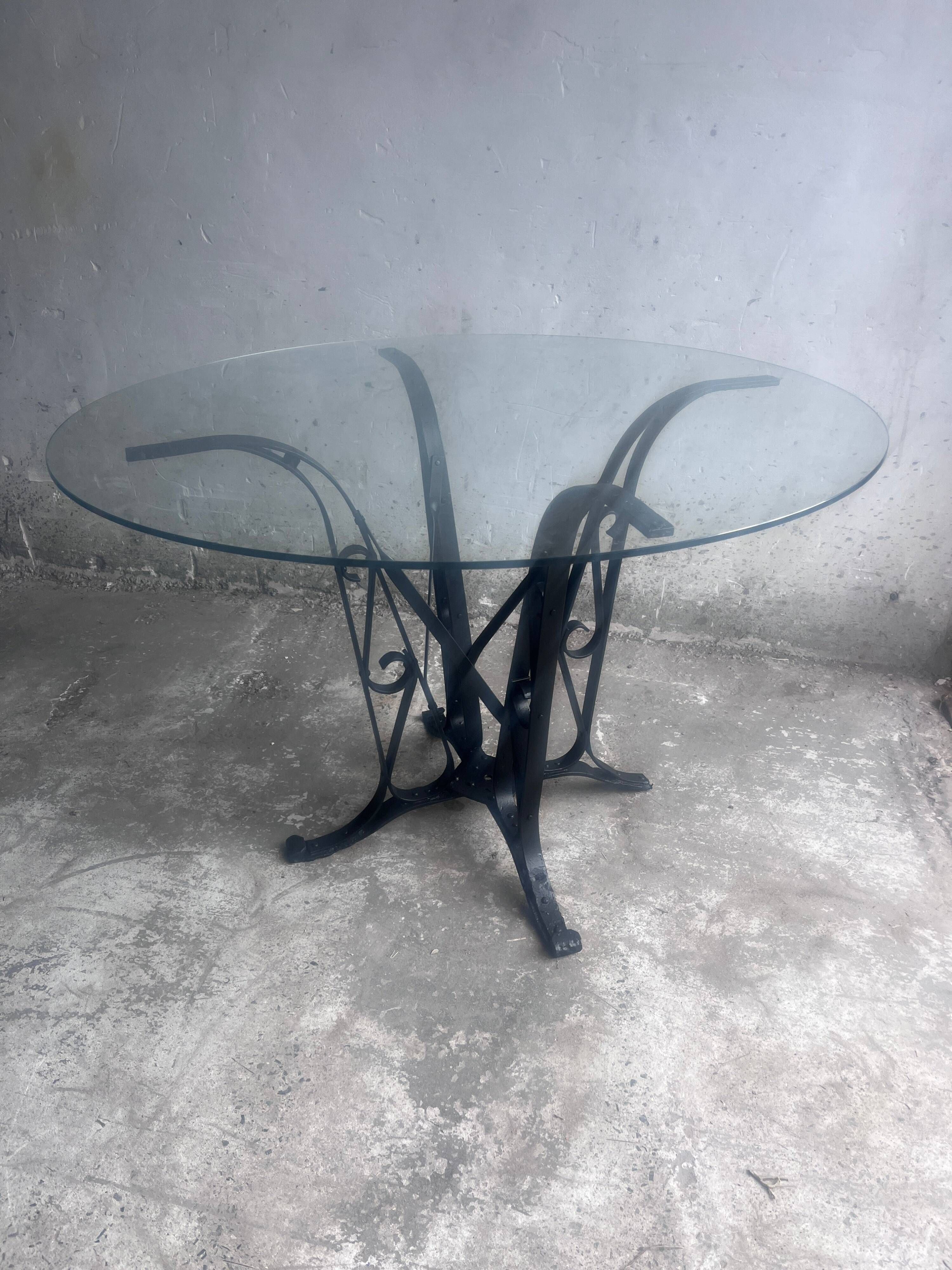 French Art Deco dining table in wrought iron and glass, circa 1930.
