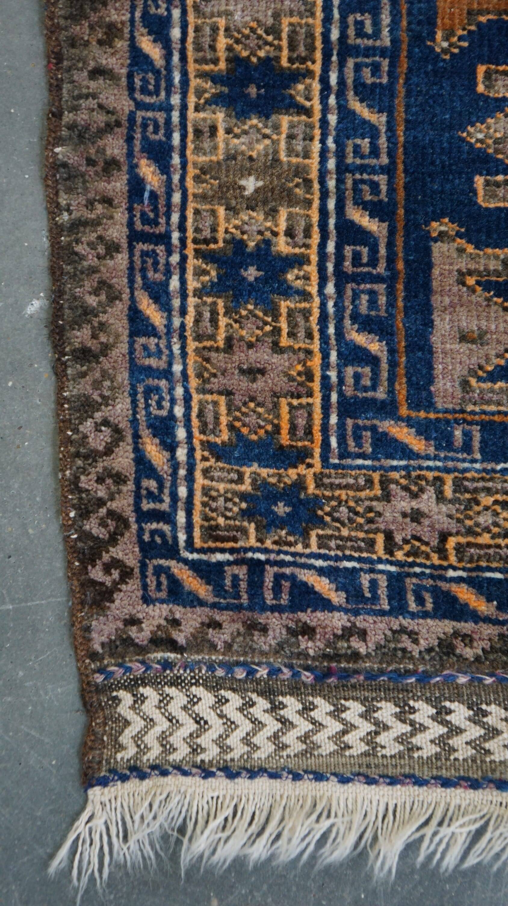 Orange and blue Persian rug 132×83 cm