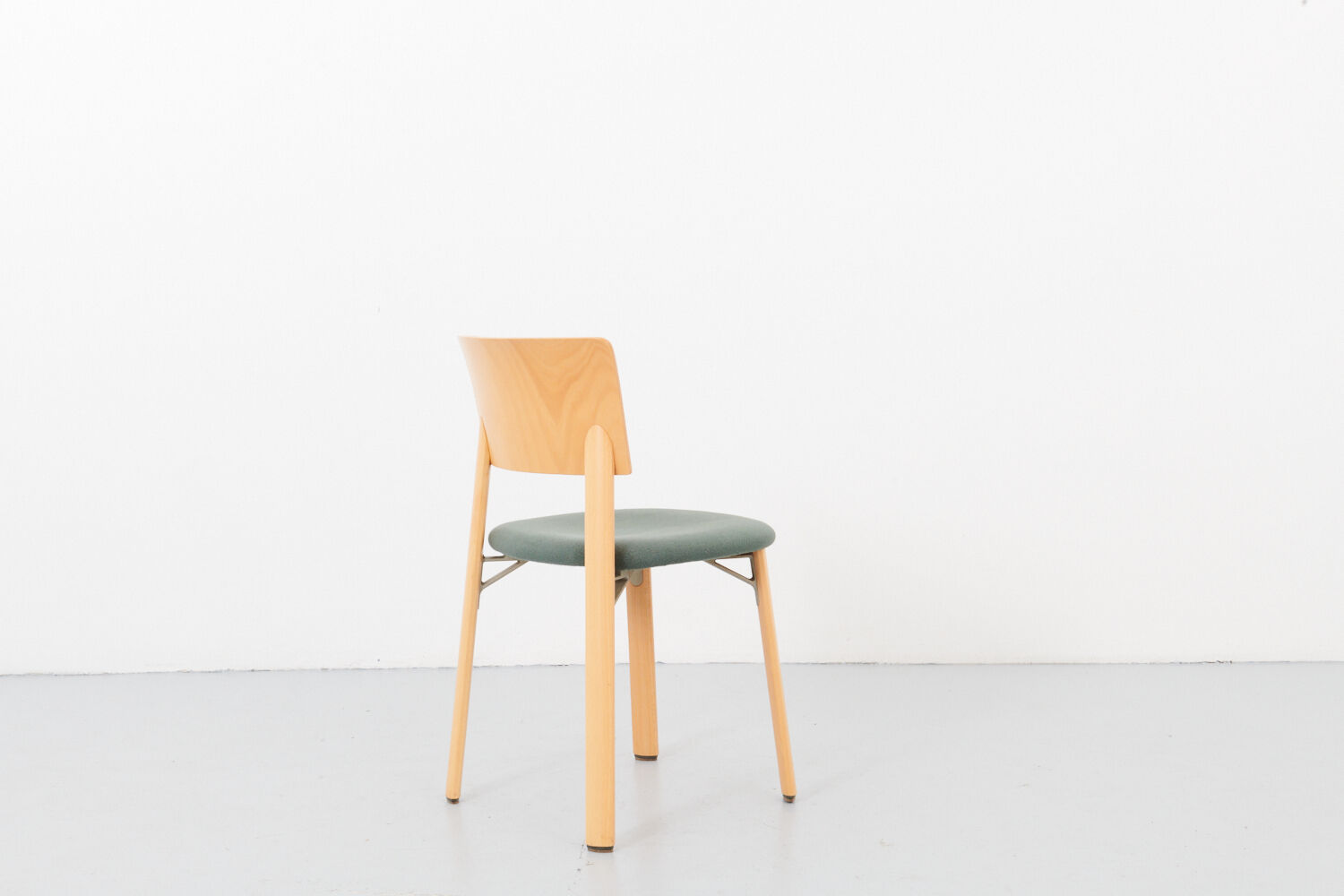 Kusch &Co chair made of wood and green fabric