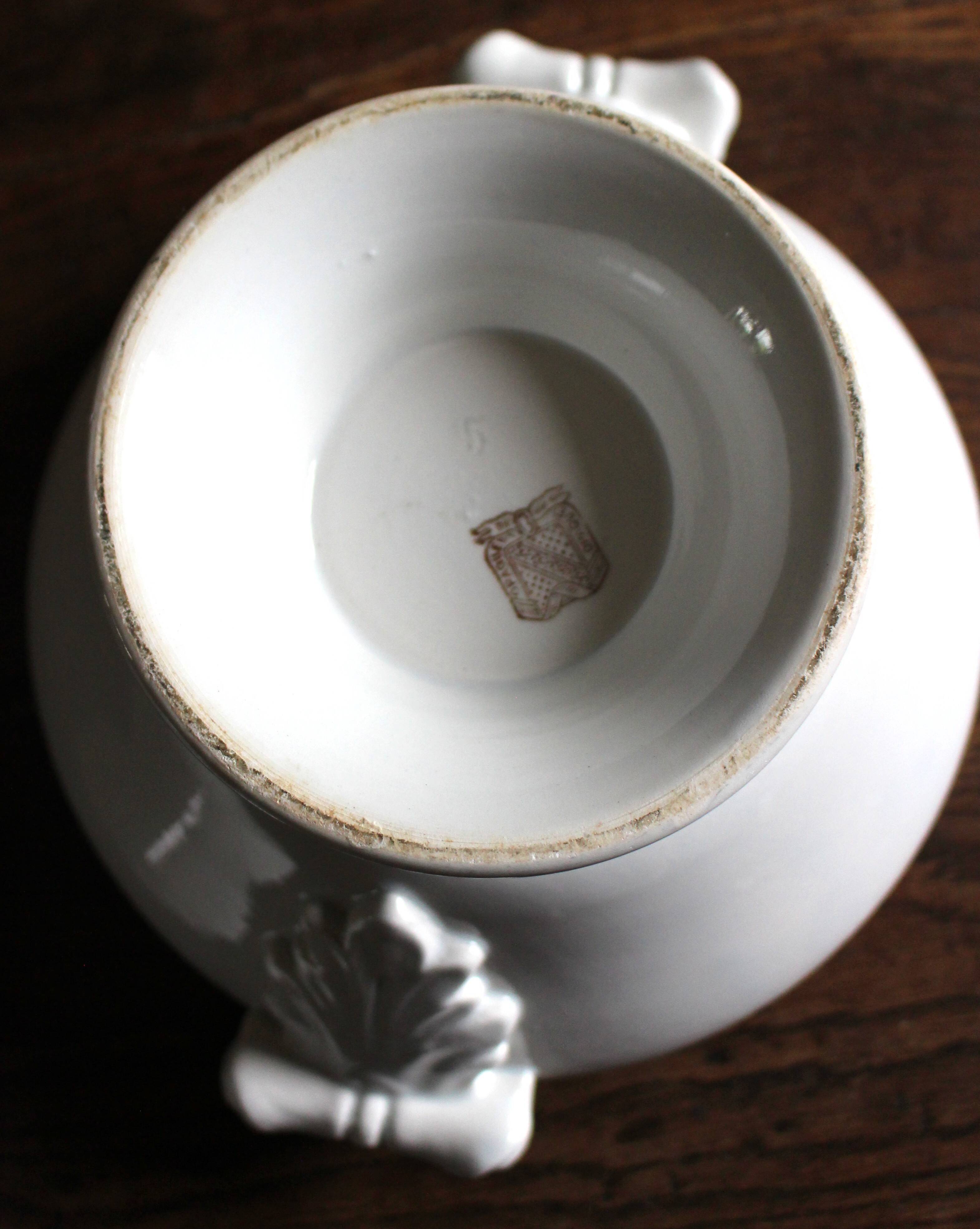 Antique soup tureen, white earthenware, with stopper decoration.