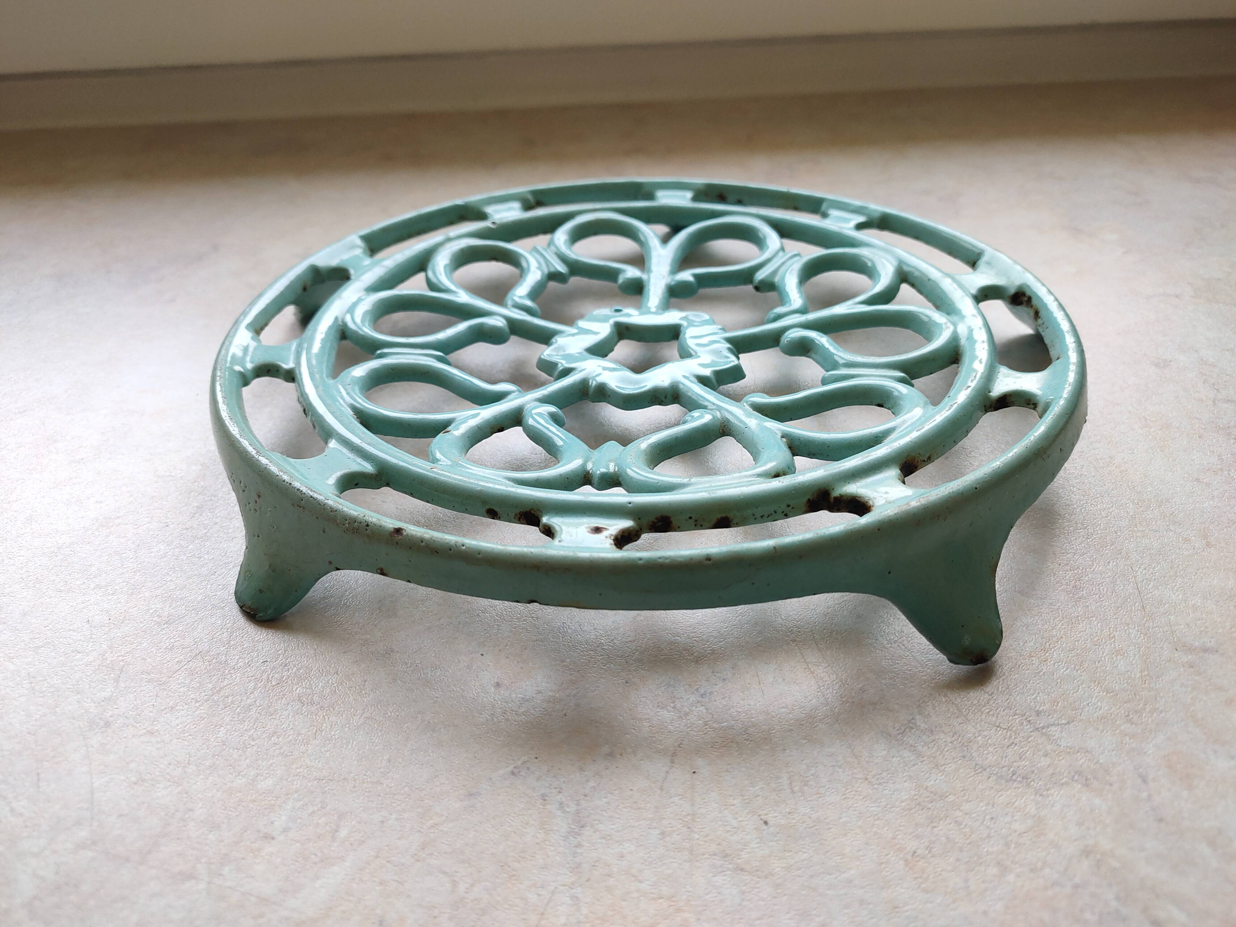 Water green enamelled trivet.