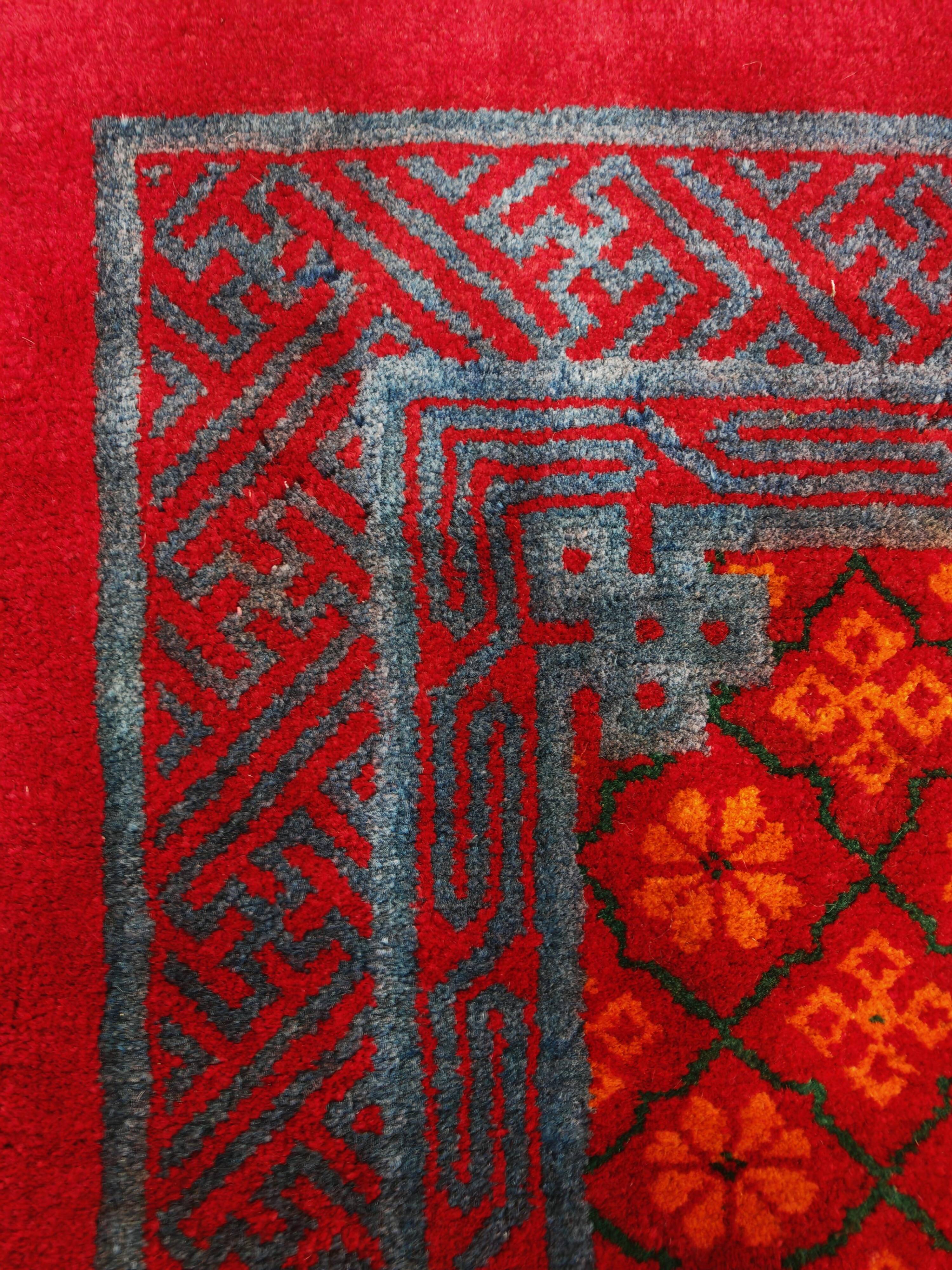 Ancient Khotan carpet, hand-knotted, floral pattern, Turkestan, 1960s.
