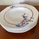 Saint Amand hollow plates decorated with red and blue flowers