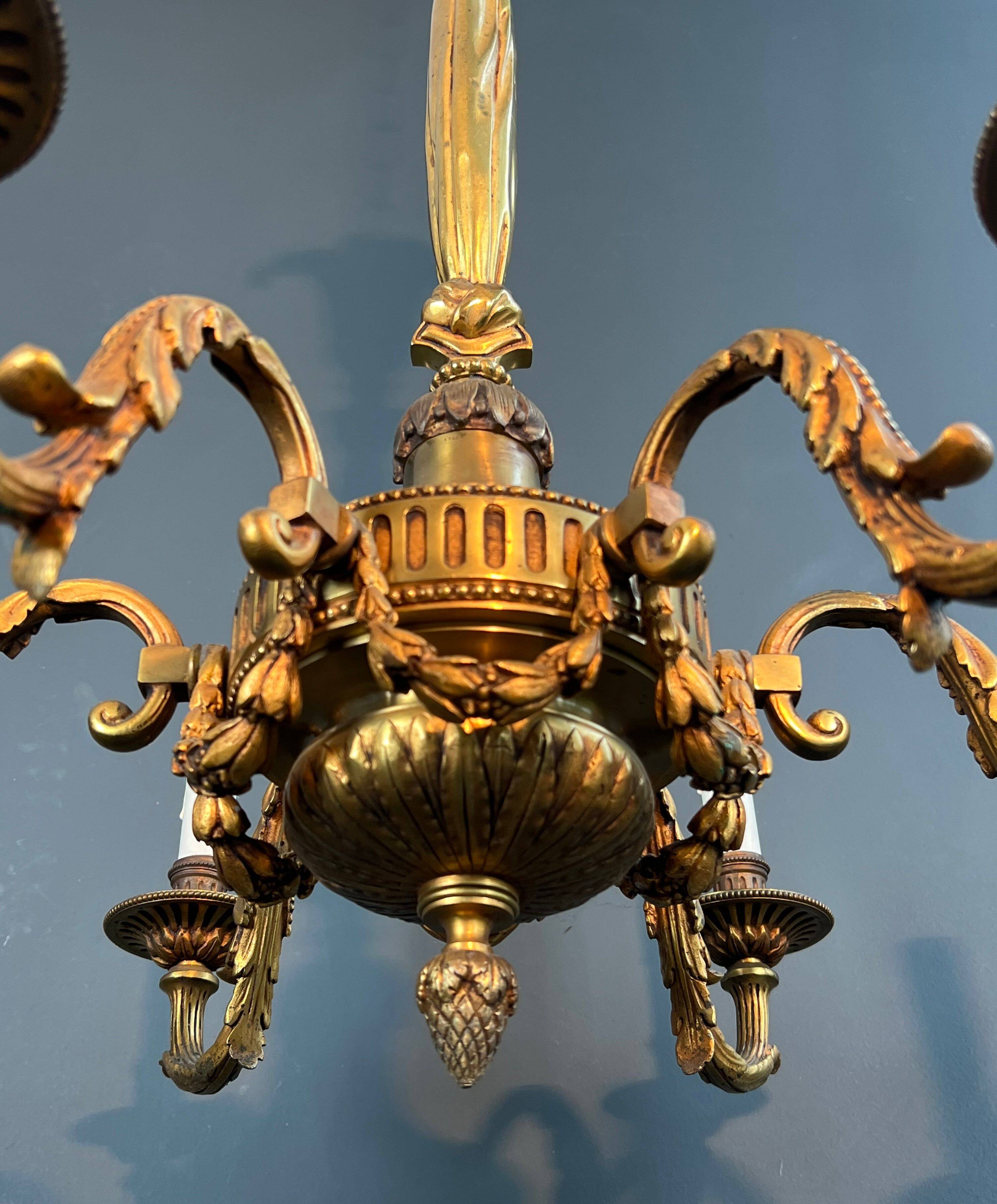 Lustre with 6 light arms in bronze in the Louis XVI style.