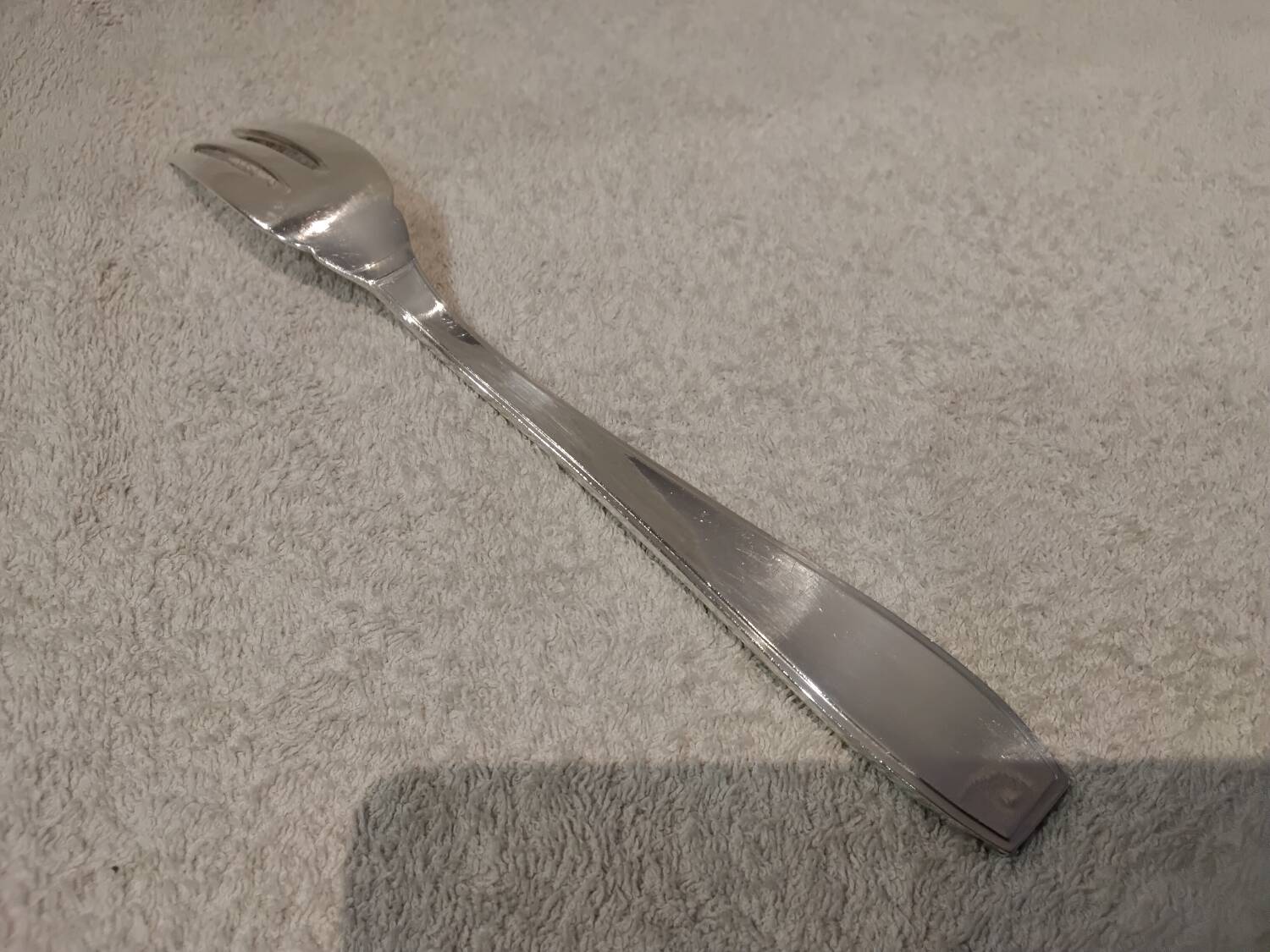 Silver-plated metal stew fork by Christofle silversmiths, Atlas model