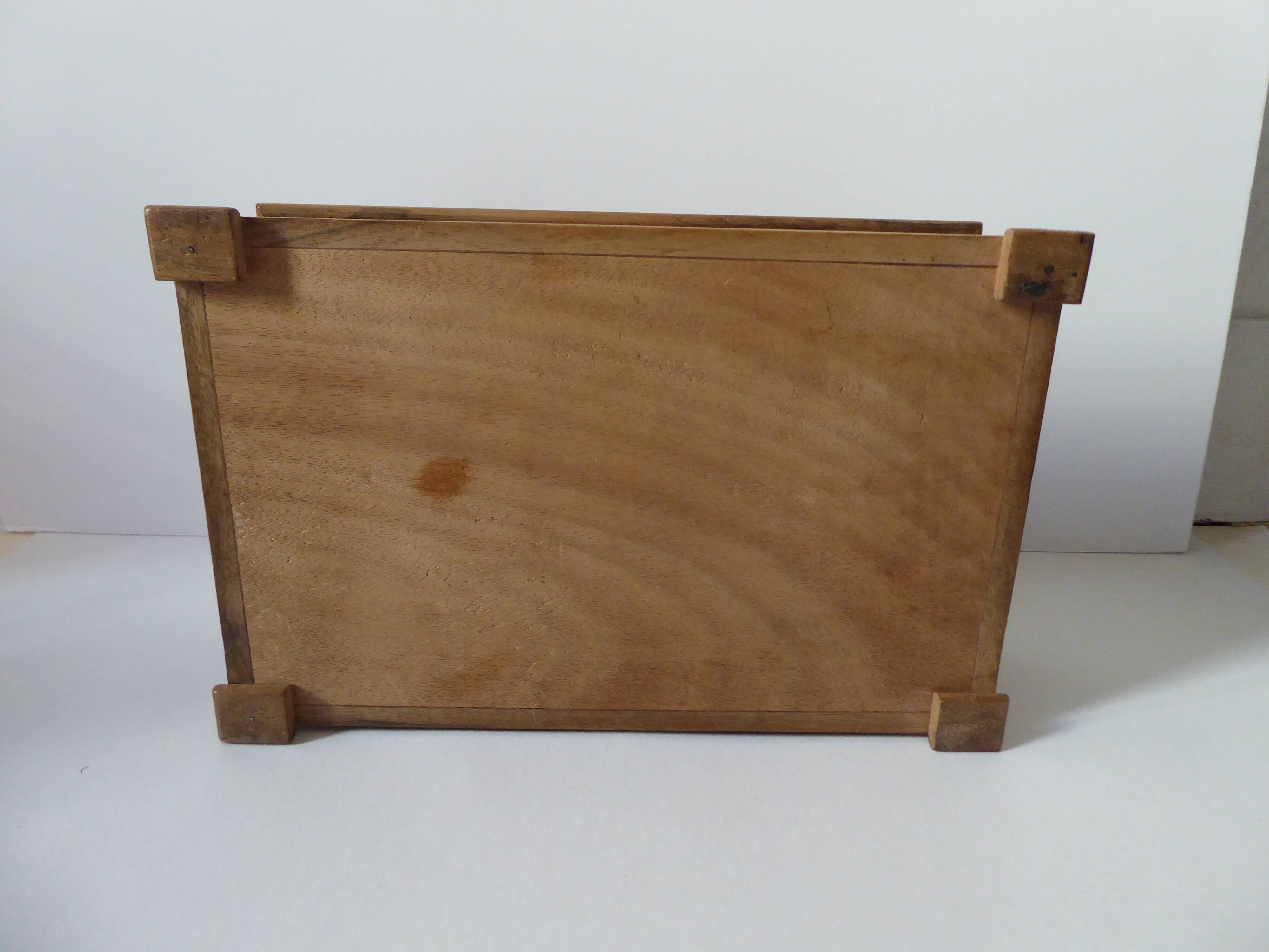 Branded wooden box decorated with suns