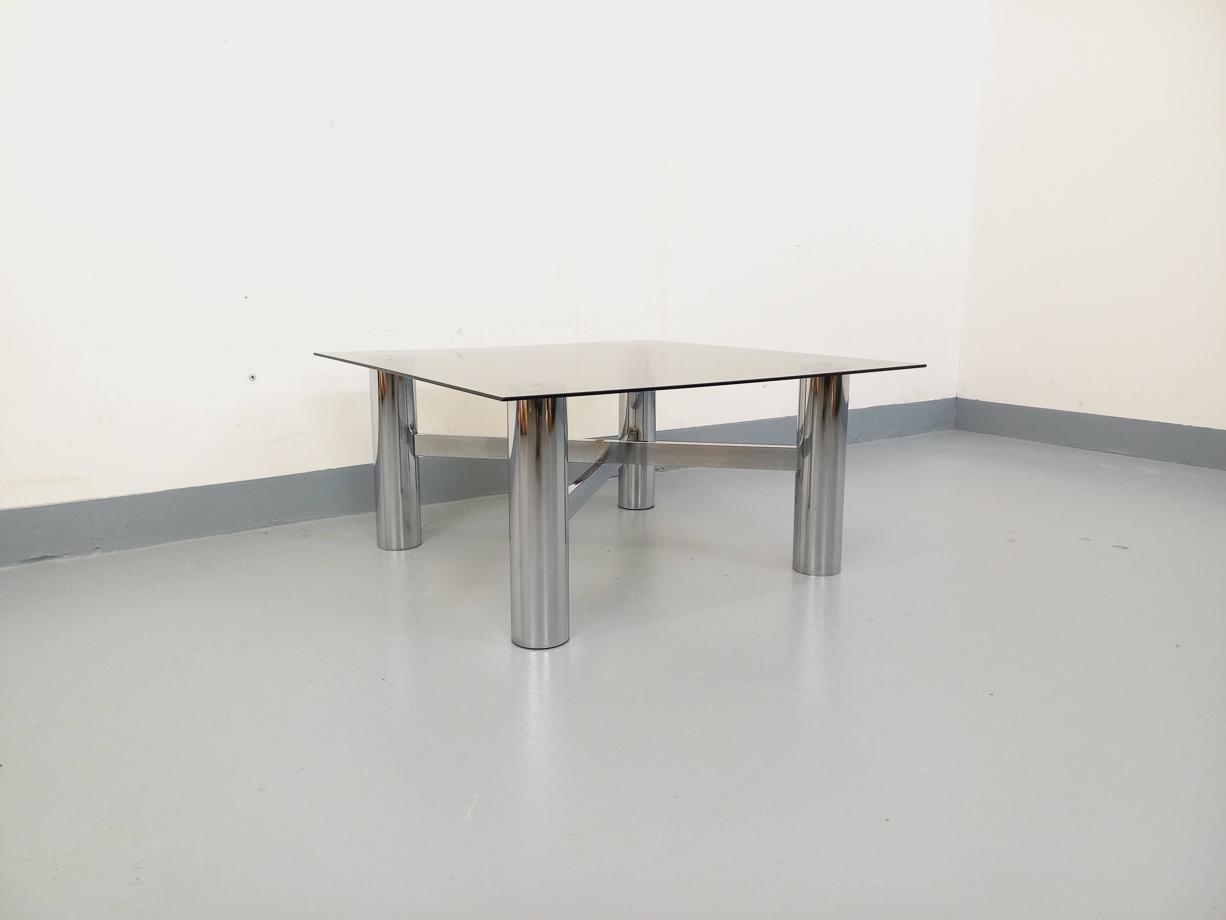 Square Italian vintage Space Age coffee table in smoked glass and metal.