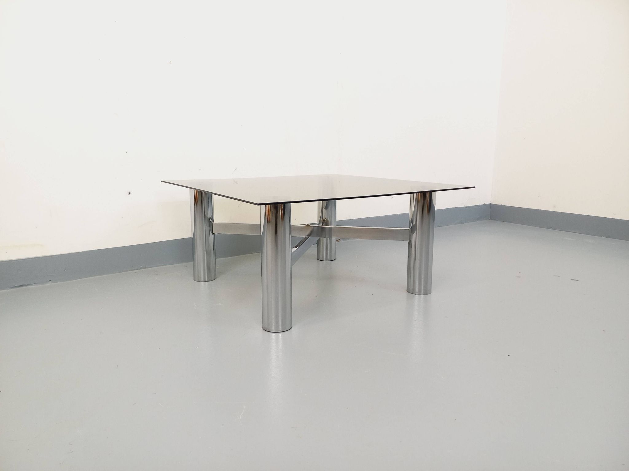 Square Italian vintage Space Age coffee table in smoked glass and metal.