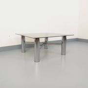 Square Italian vintage Space Age coffee table in smoked glass and metal.