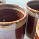 Service of 6 coffee cups in handcrafted glazed ceramic, amber brown, 1970.