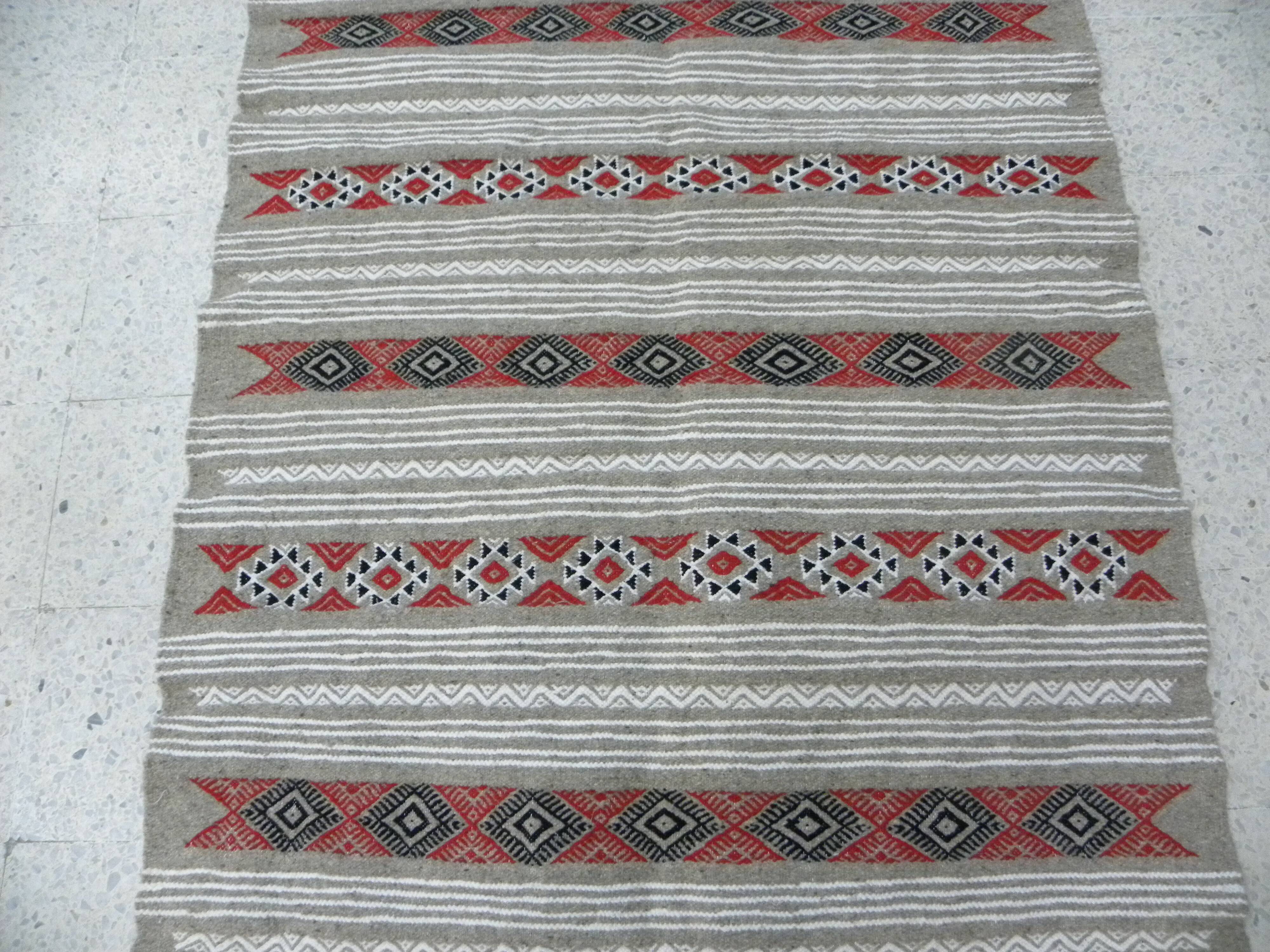 Geometric woven rug with fringes – Ethnic style – Hallway & interior