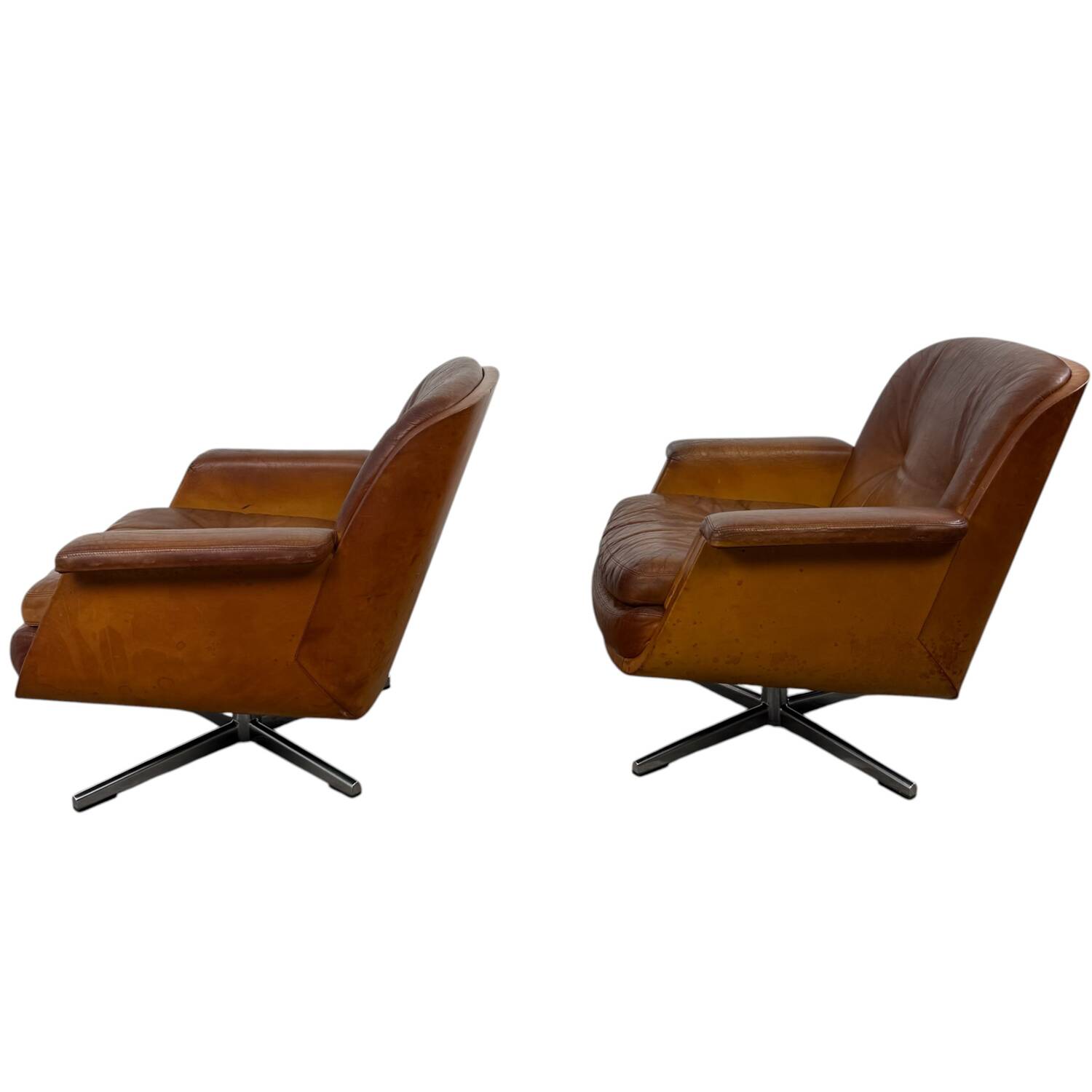 Paire de fauteuils pivotants vintage en cuir cognac par Eugen Schmidt