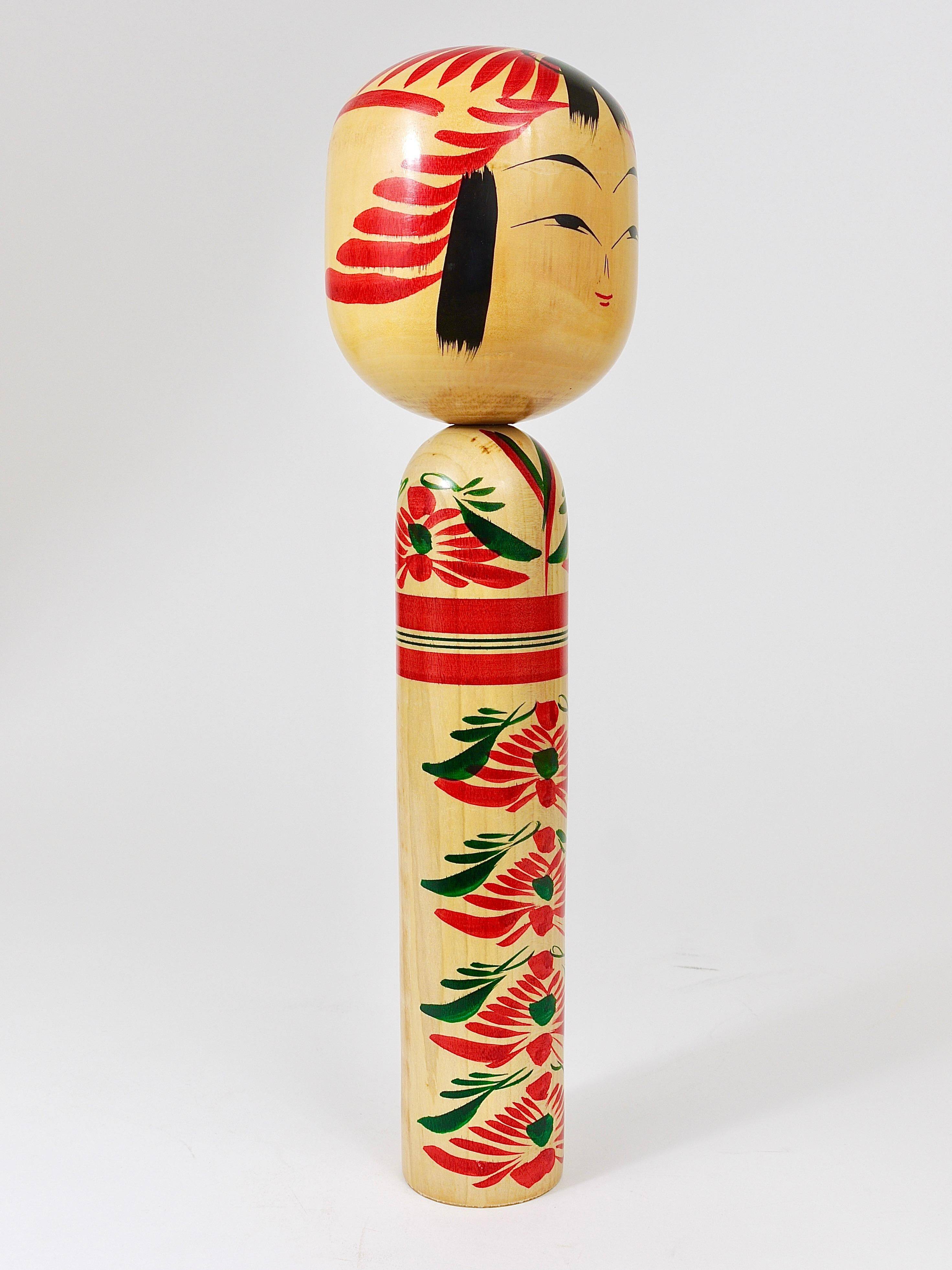 Decorative Kokeshi doll sculpture from northern Japan, hand-painted, signed.