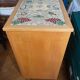 New oak storage furniture with a signed artisanal mosaic top.