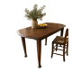 Vintage antique oak table with ornate legs.