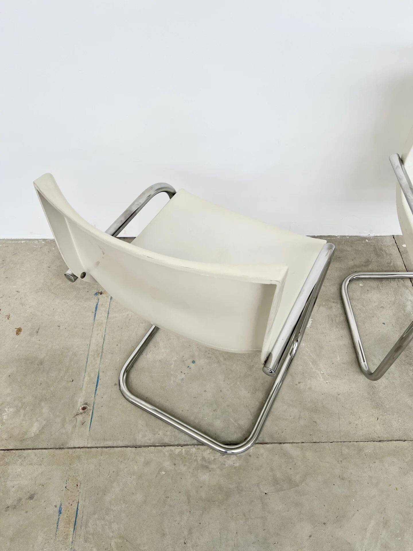 Pair of white moulded shell chairs with chrome tube — Space Age 70s