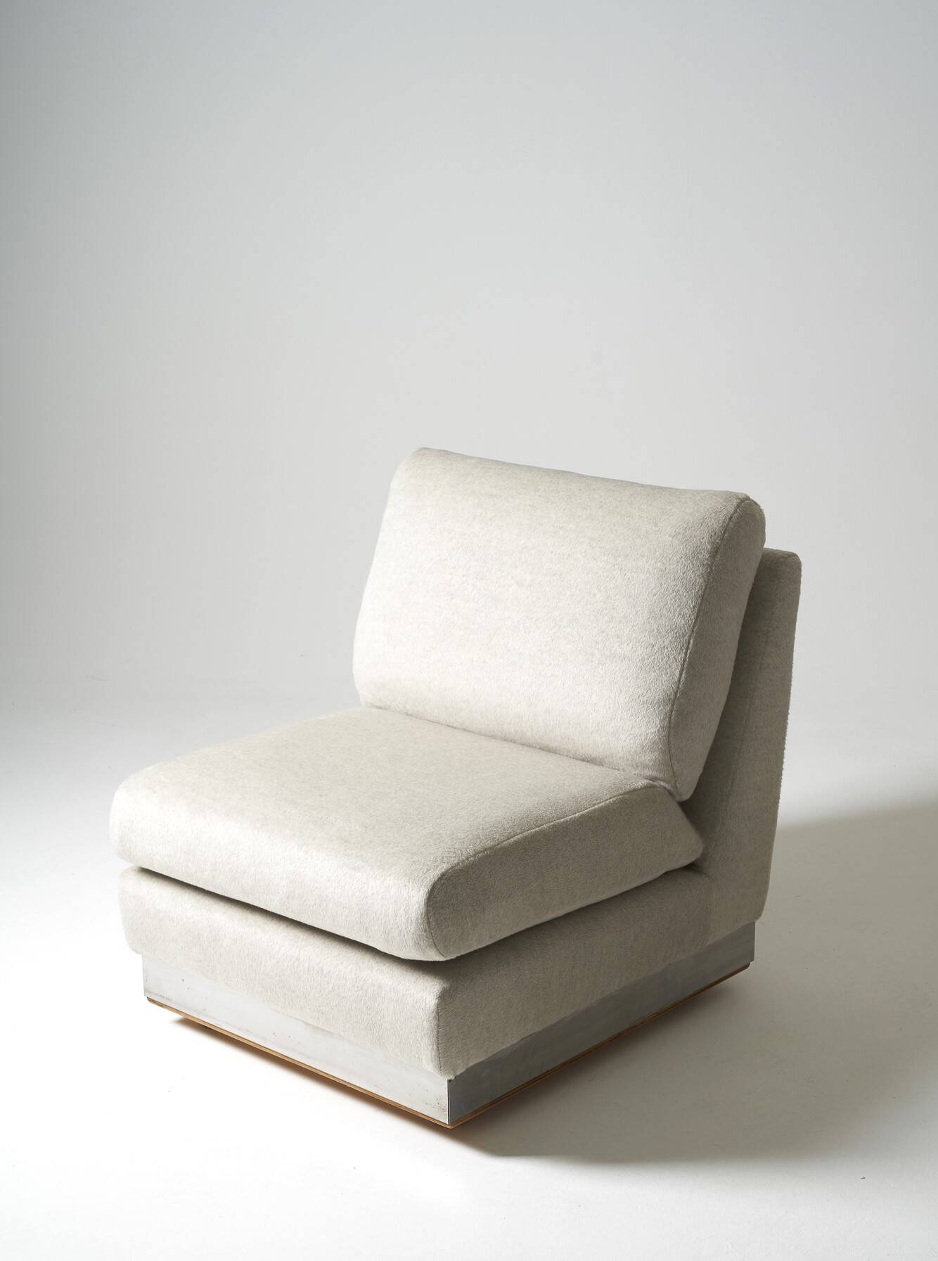 Beige fireside chair by Jacques Charpentier