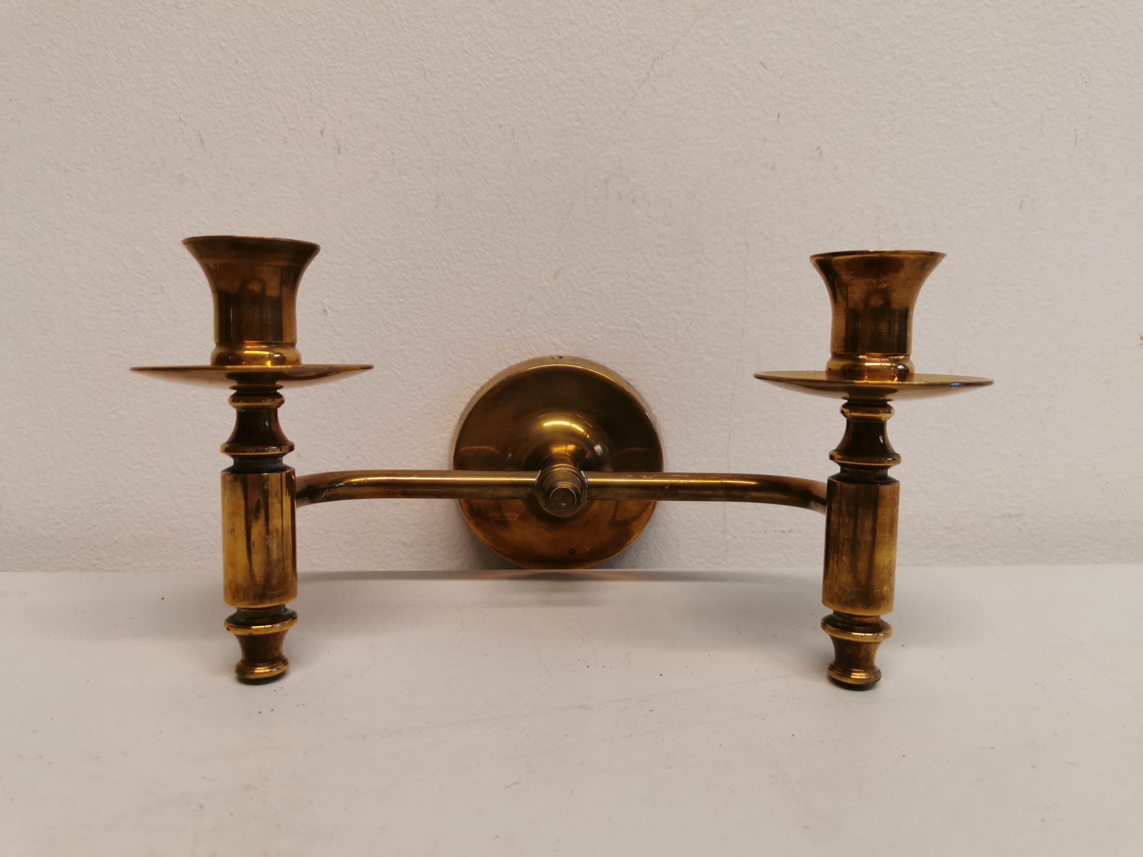 Classic Danish wall hung design candlestick in solid brass