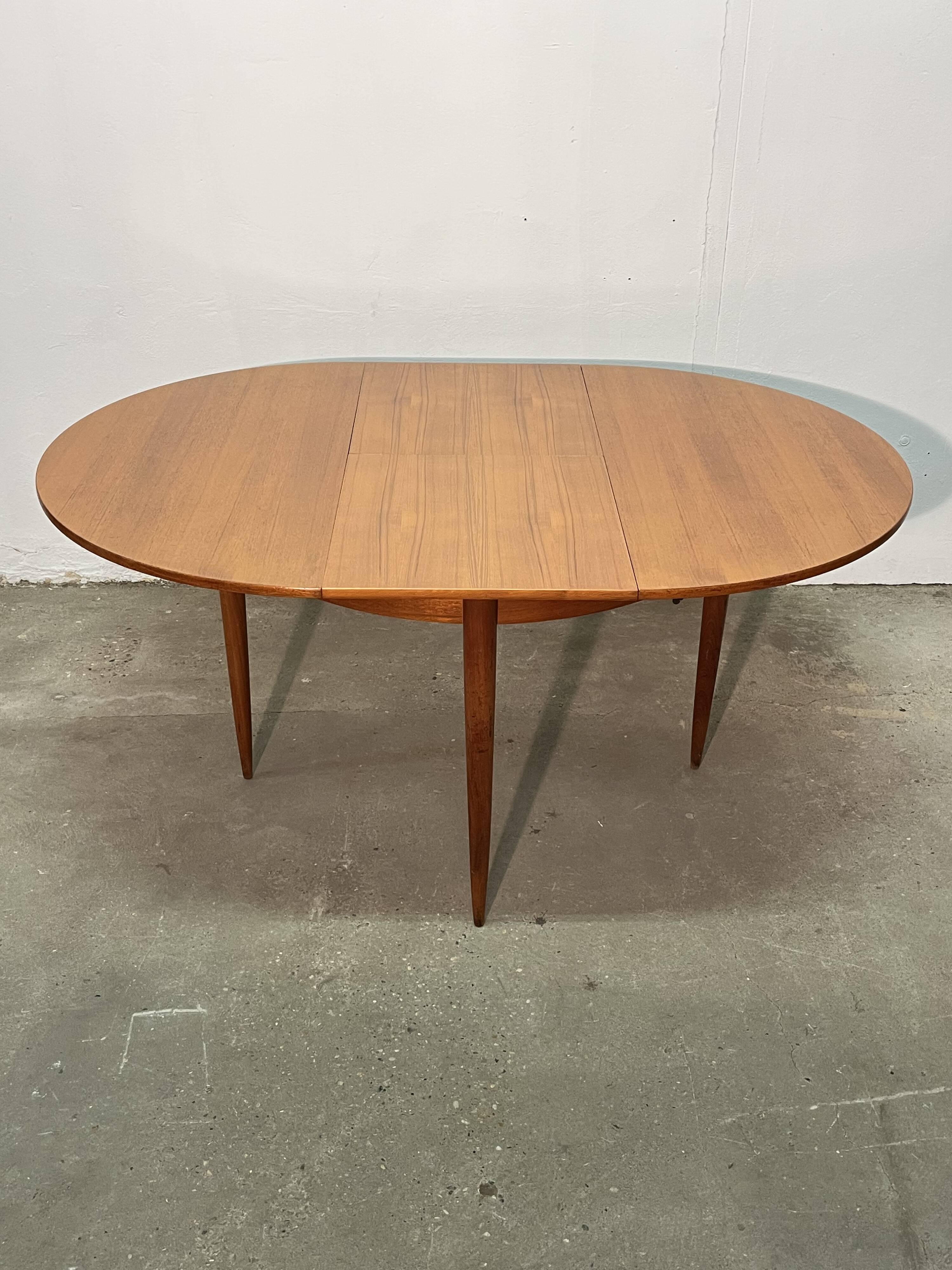 Vintage 1960s teak extendable Scandinavian table.
