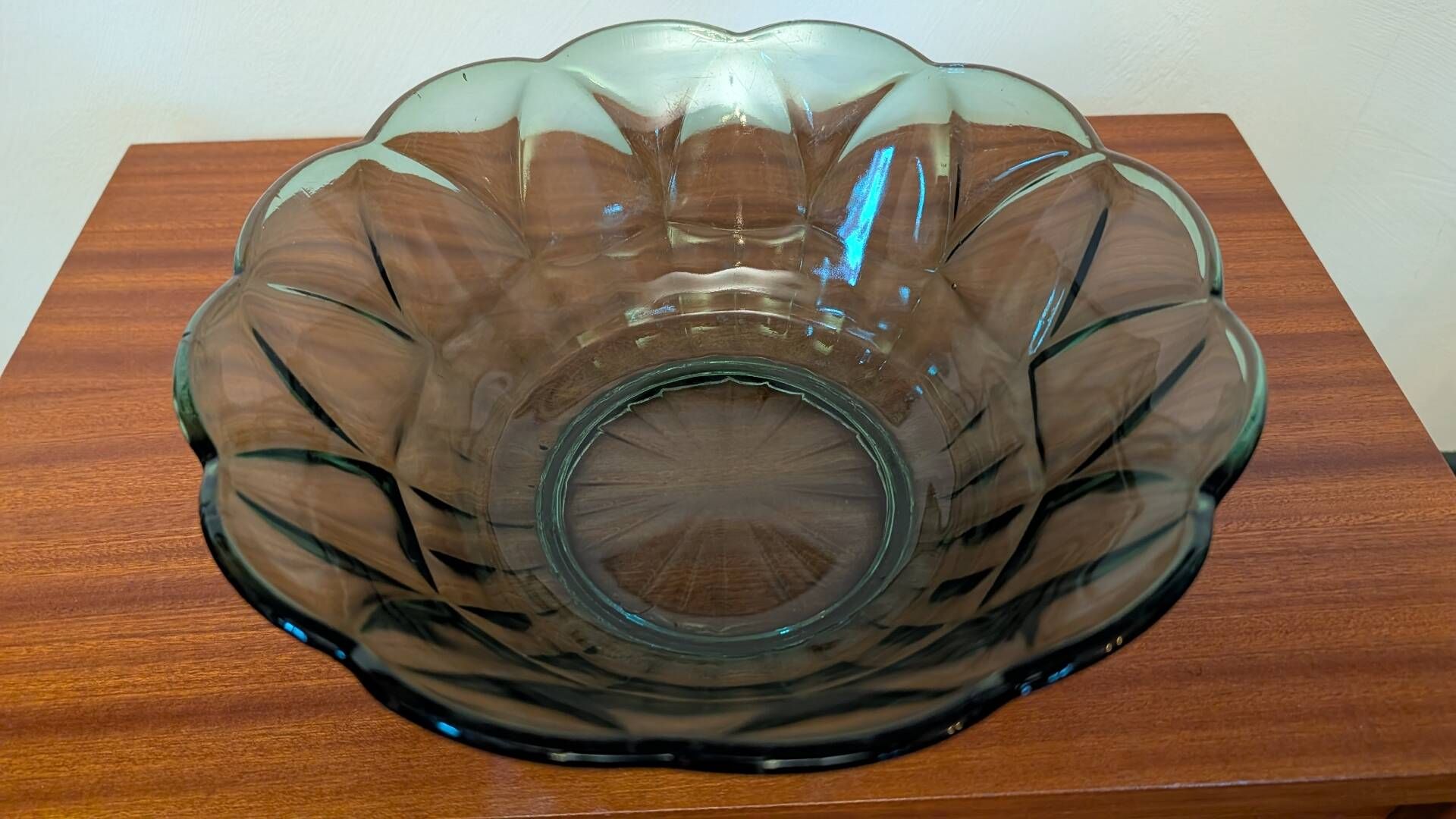 Vintage green smoked glass coupe with geometric decoration.