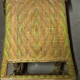 Old long chair rattan wicker garden armchair