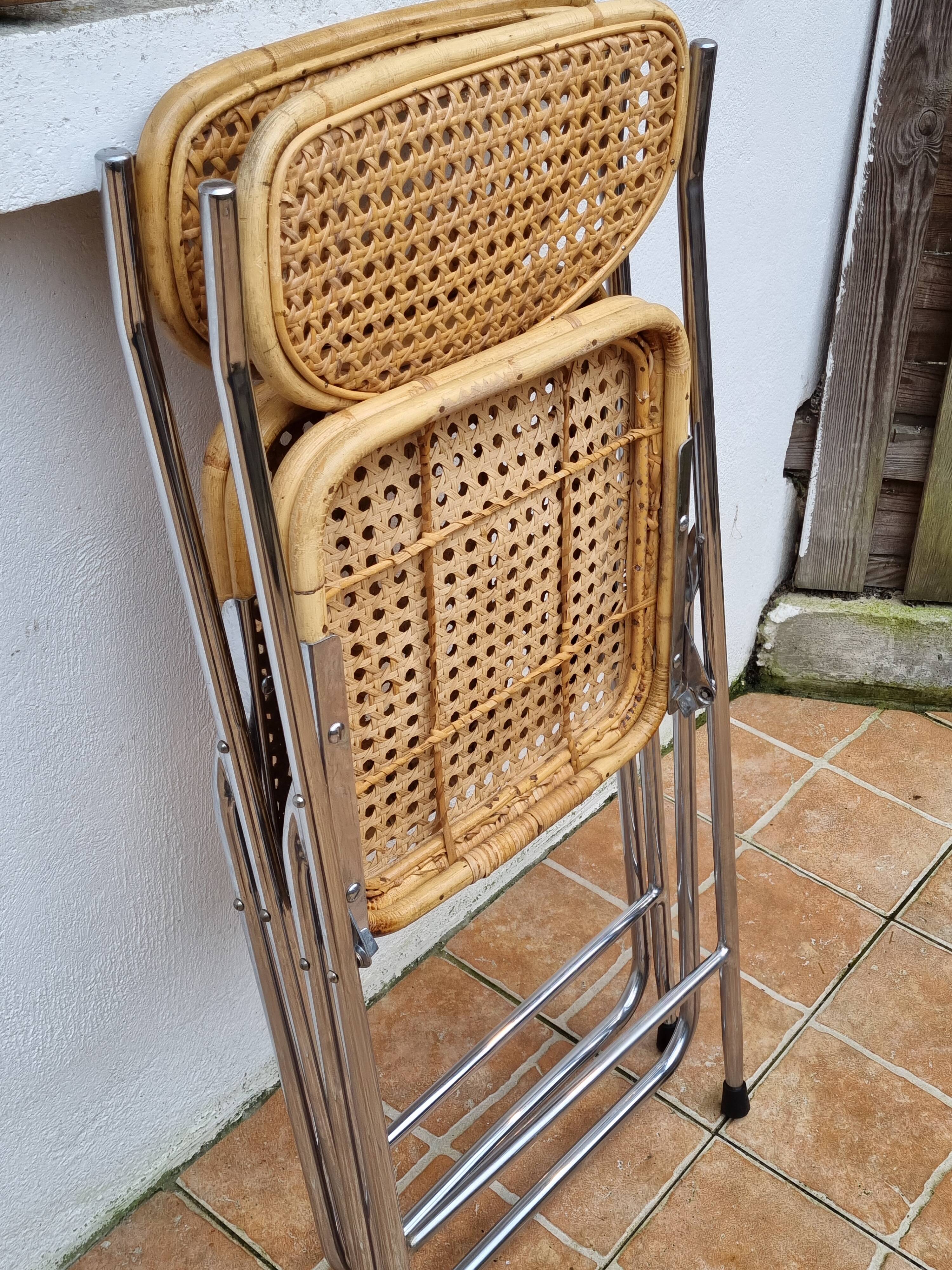 Pair of vintage metal and cane folding chairs