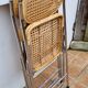 Pair of vintage metal and cane folding chairs