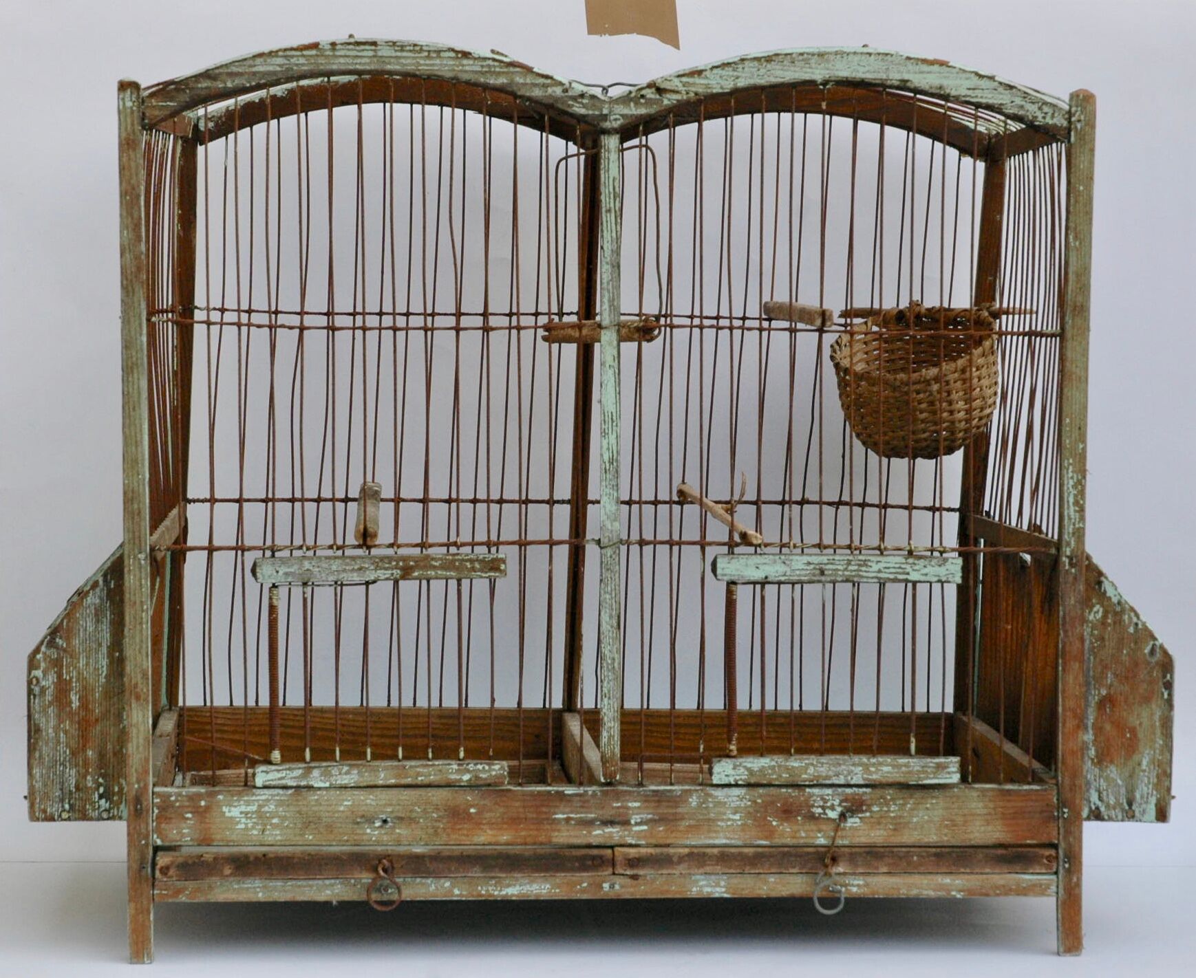 Ancient bird cage in wood and metal