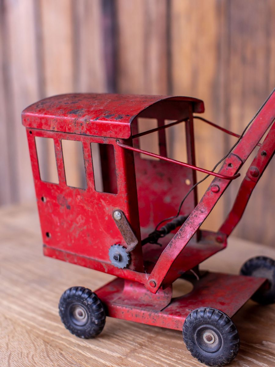 Old toy truck crane in sheet metal