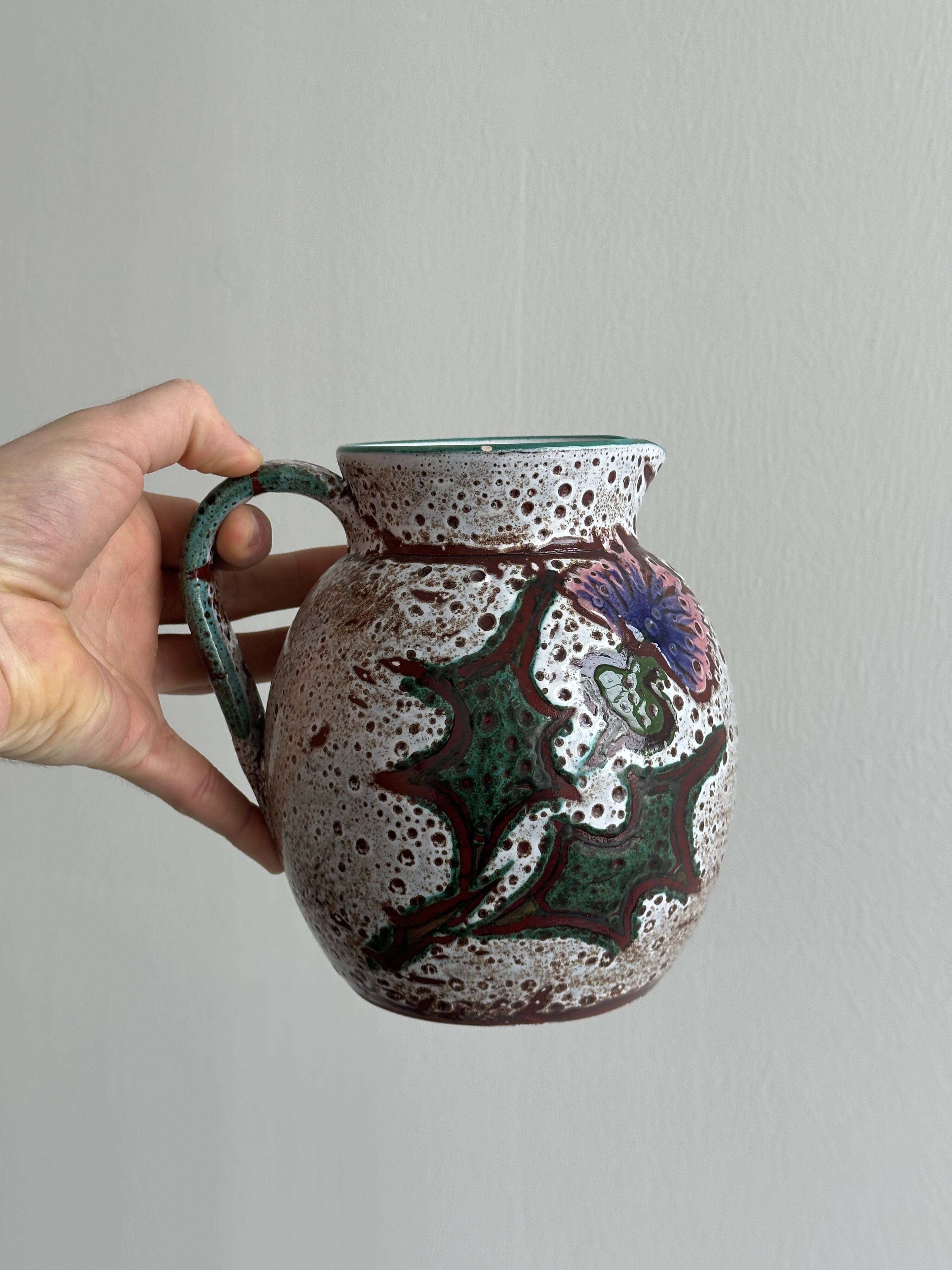 Antique decorative ceramic pitcher