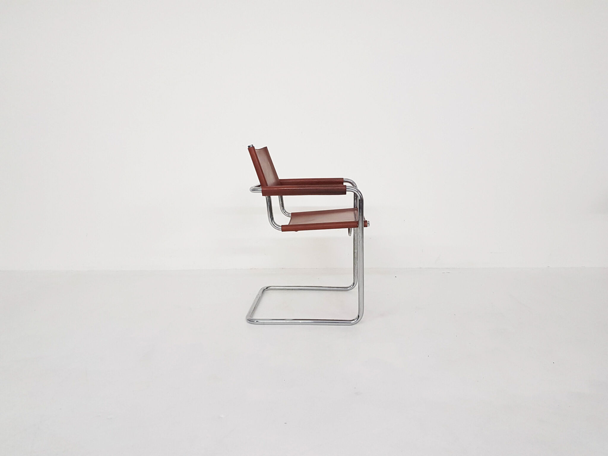 Tubular dining chair with arm rests, 1970's