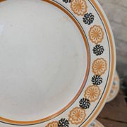 10 dessert plates Saint Amand Amandinoise frilled with orange and black flowers.