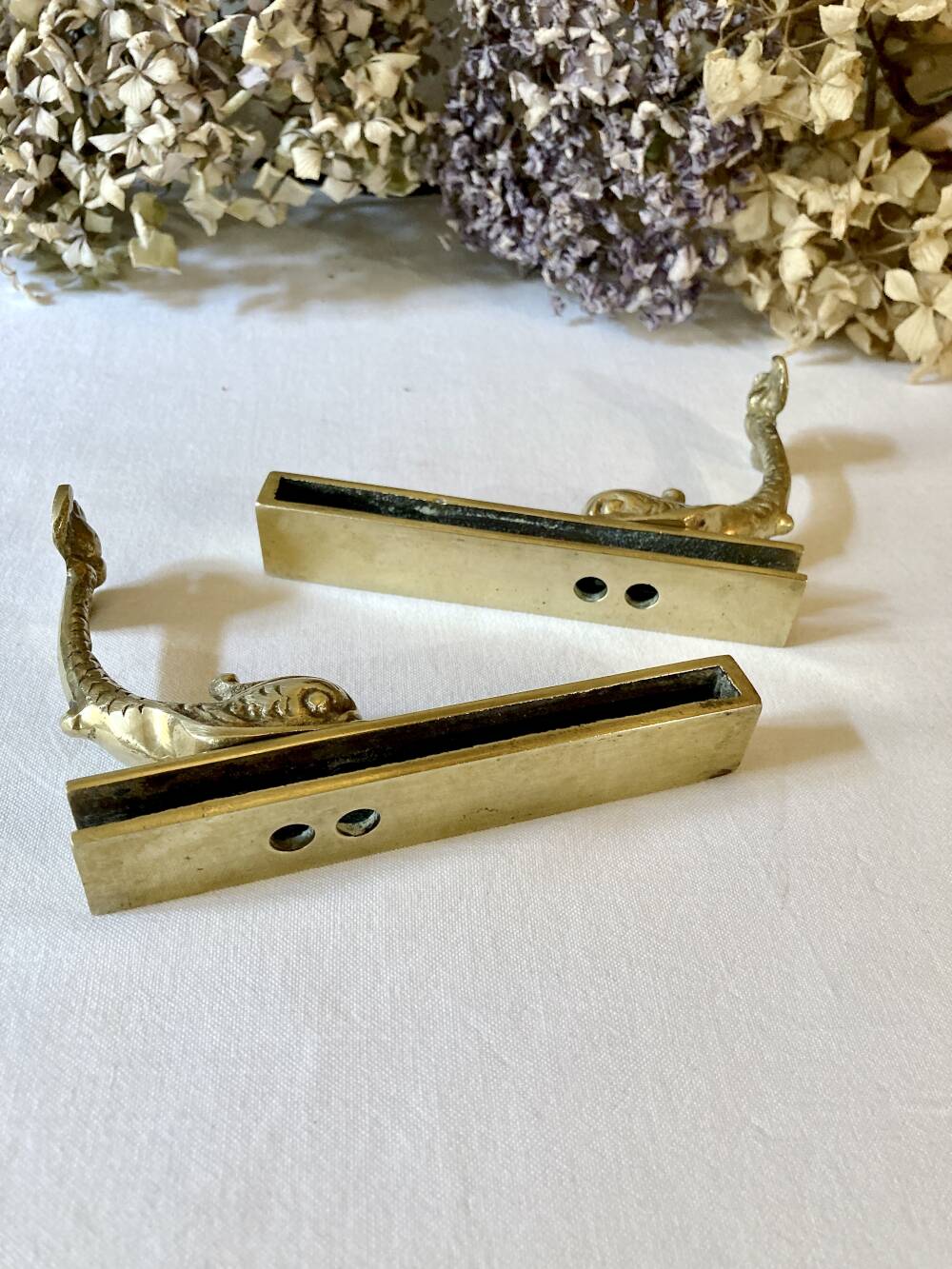 Brass wall supports for bathroom shelf, circa 1950.