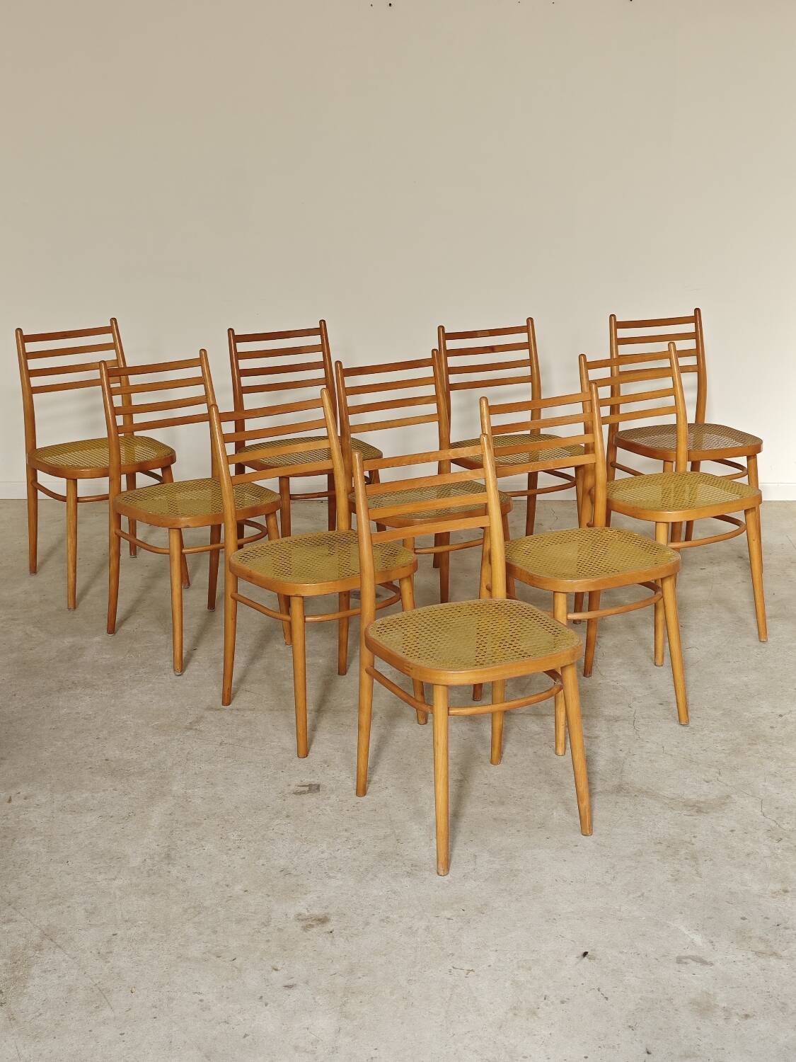 Set of 10 Bystrice tone wooden and caned chairs from the 1960s.