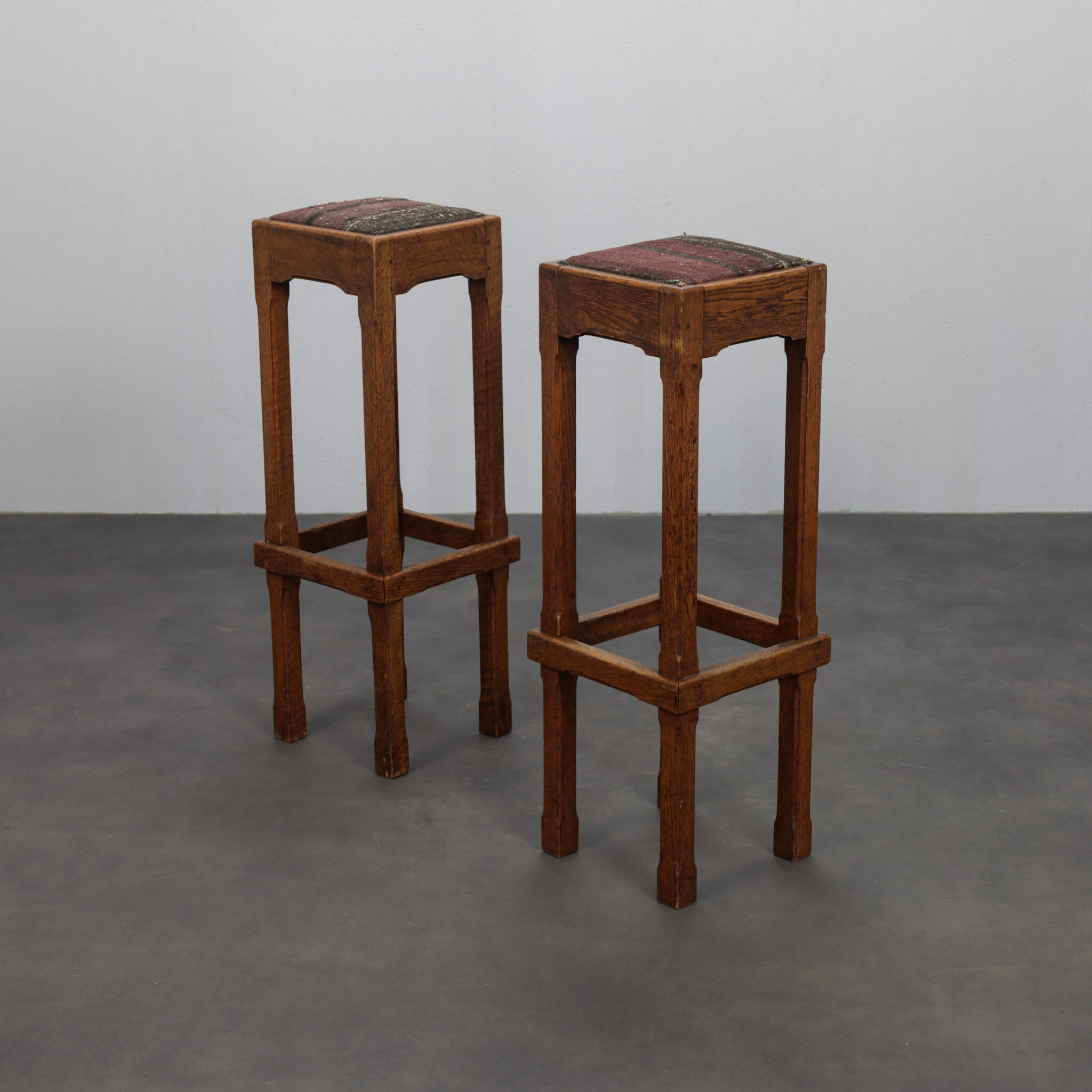 Pair of Dutch Art Deco oak bar stools with upholstered seats, 1930s