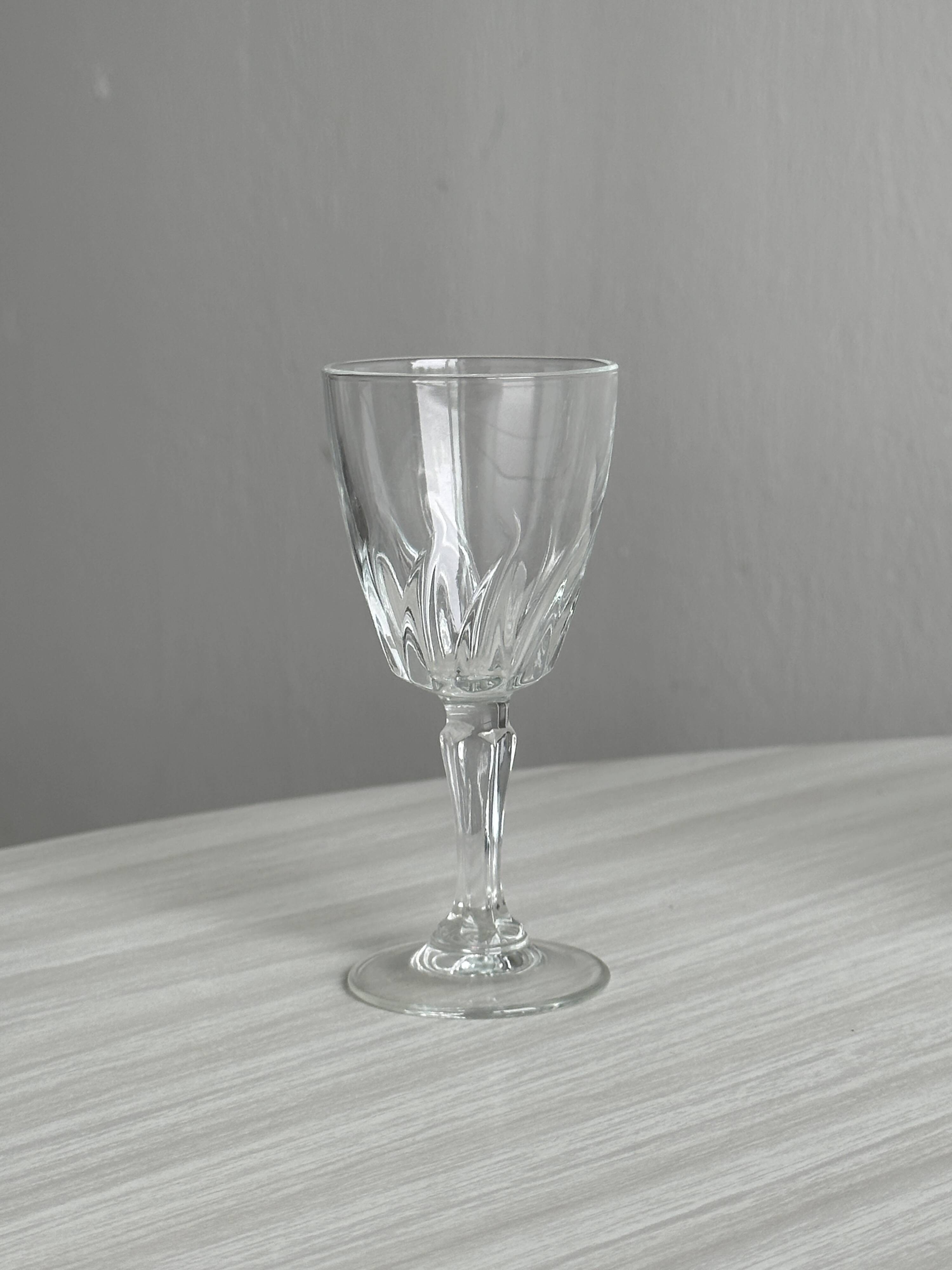 5 clear crystal liqueur glasses.
