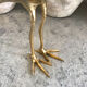 Crested bird in golden brass
