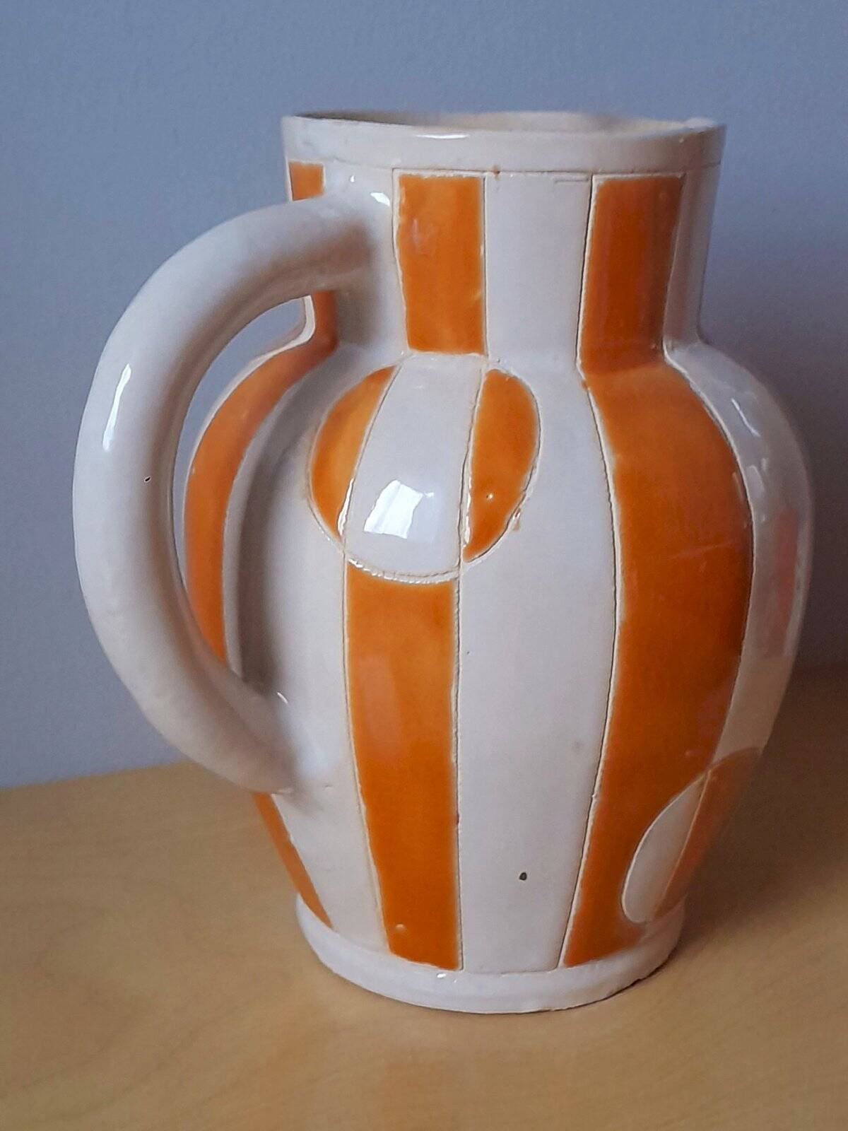 Old enamelled ceramic jug